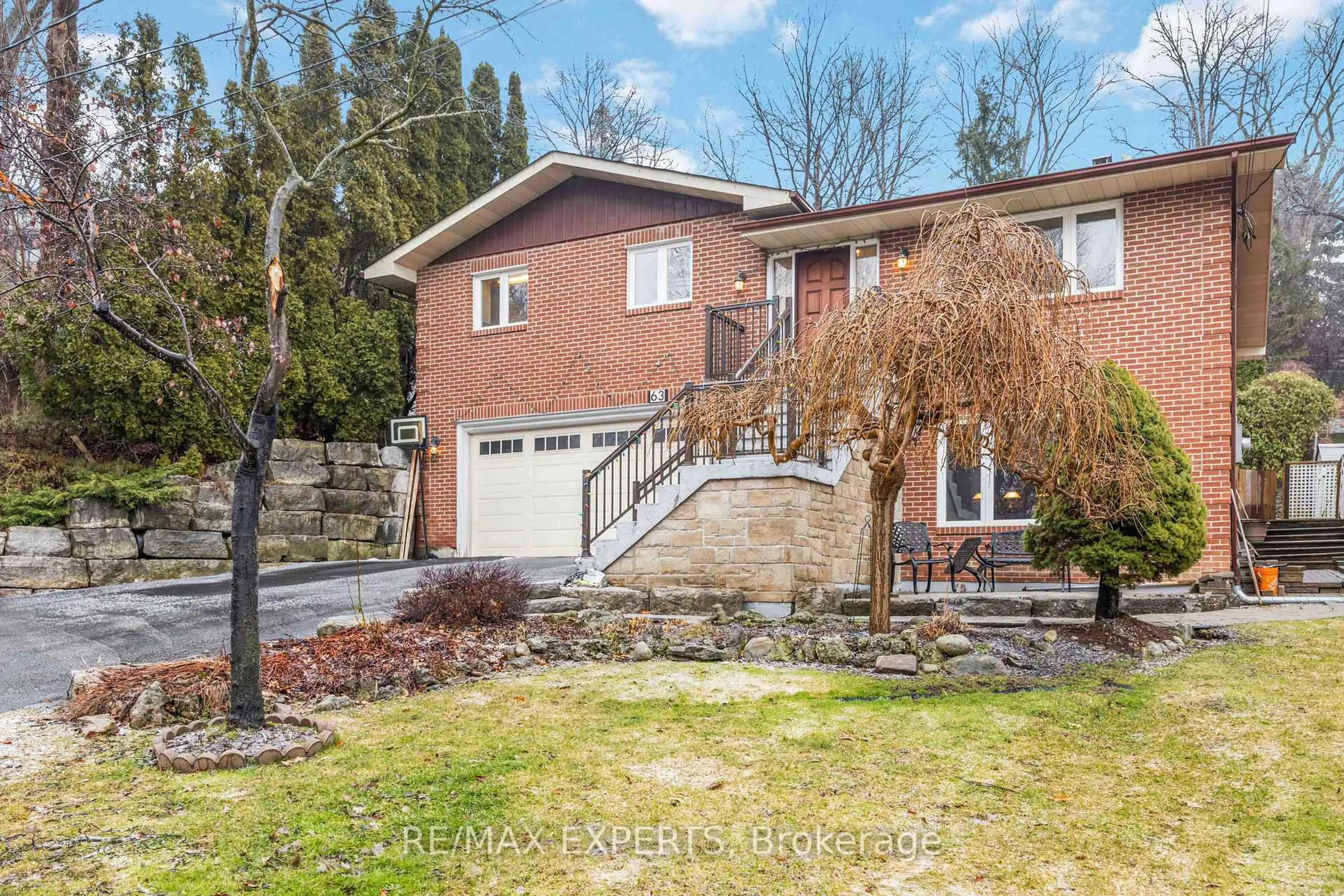 Home with brick exterior material, street for 63 Riverside Dr, Toronto Ontario M9L 1J2