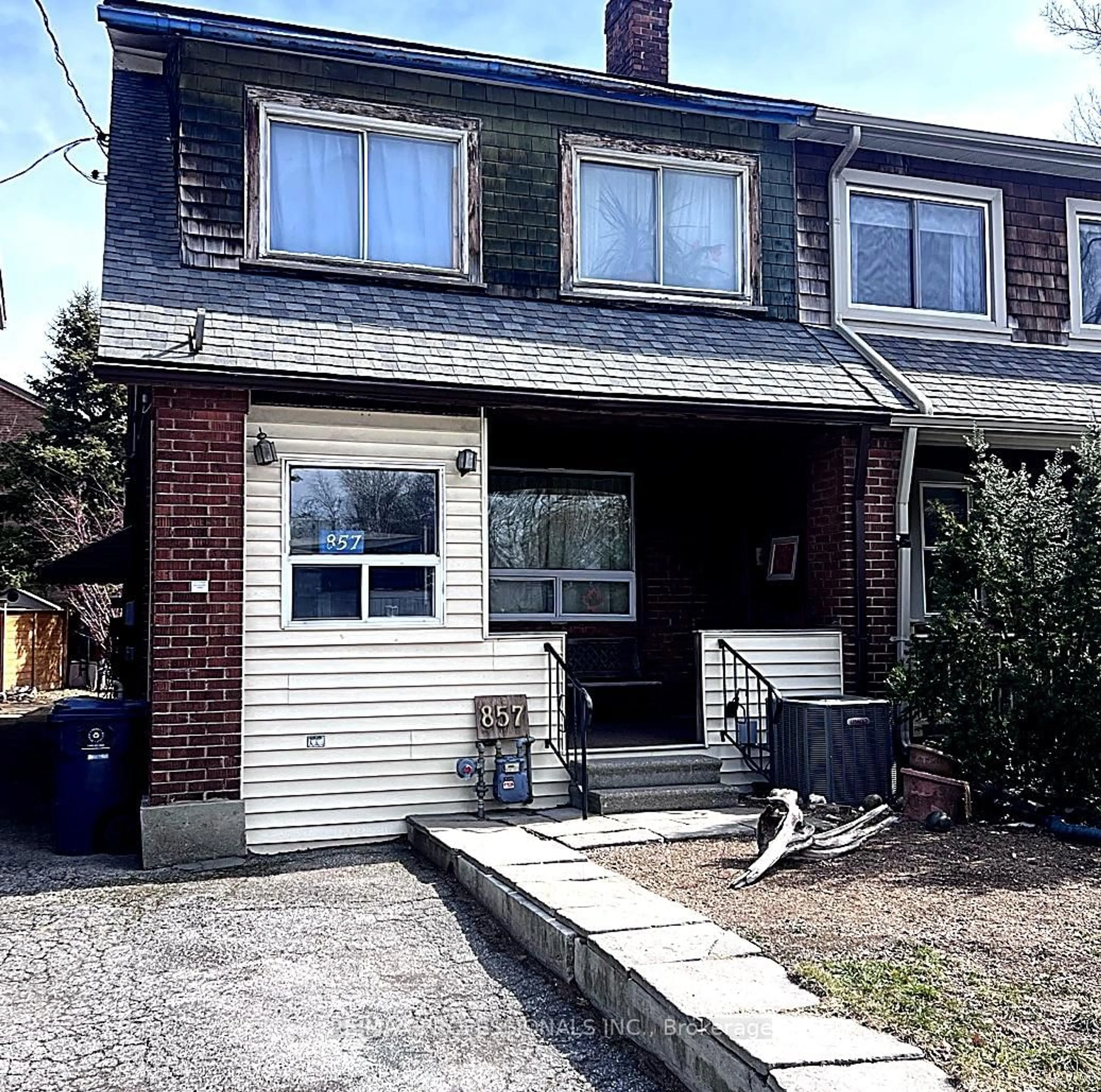 Home with brick exterior material, street for 857 Windermere Ave, Toronto Ontario M6S 3M5