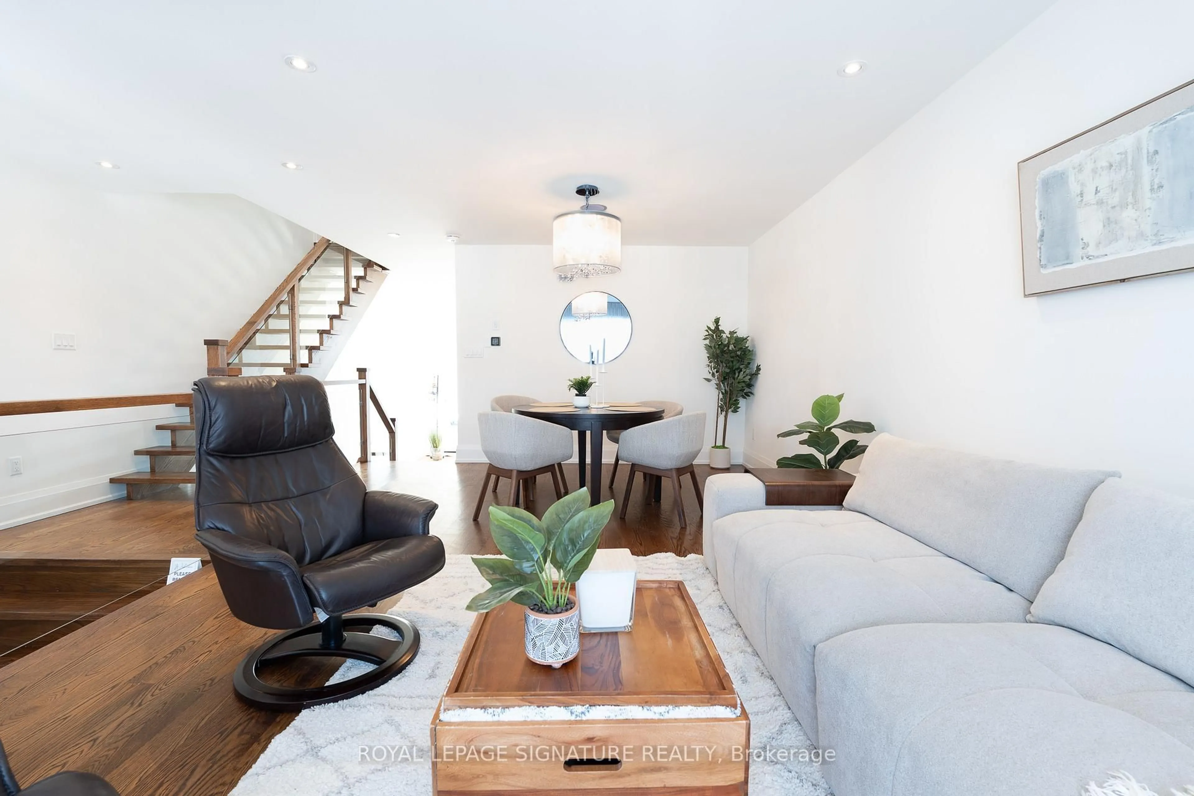 Living room with furniture, wood/laminate floor for 119B Hillside Ave, Toronto Ontario M8V 1T3