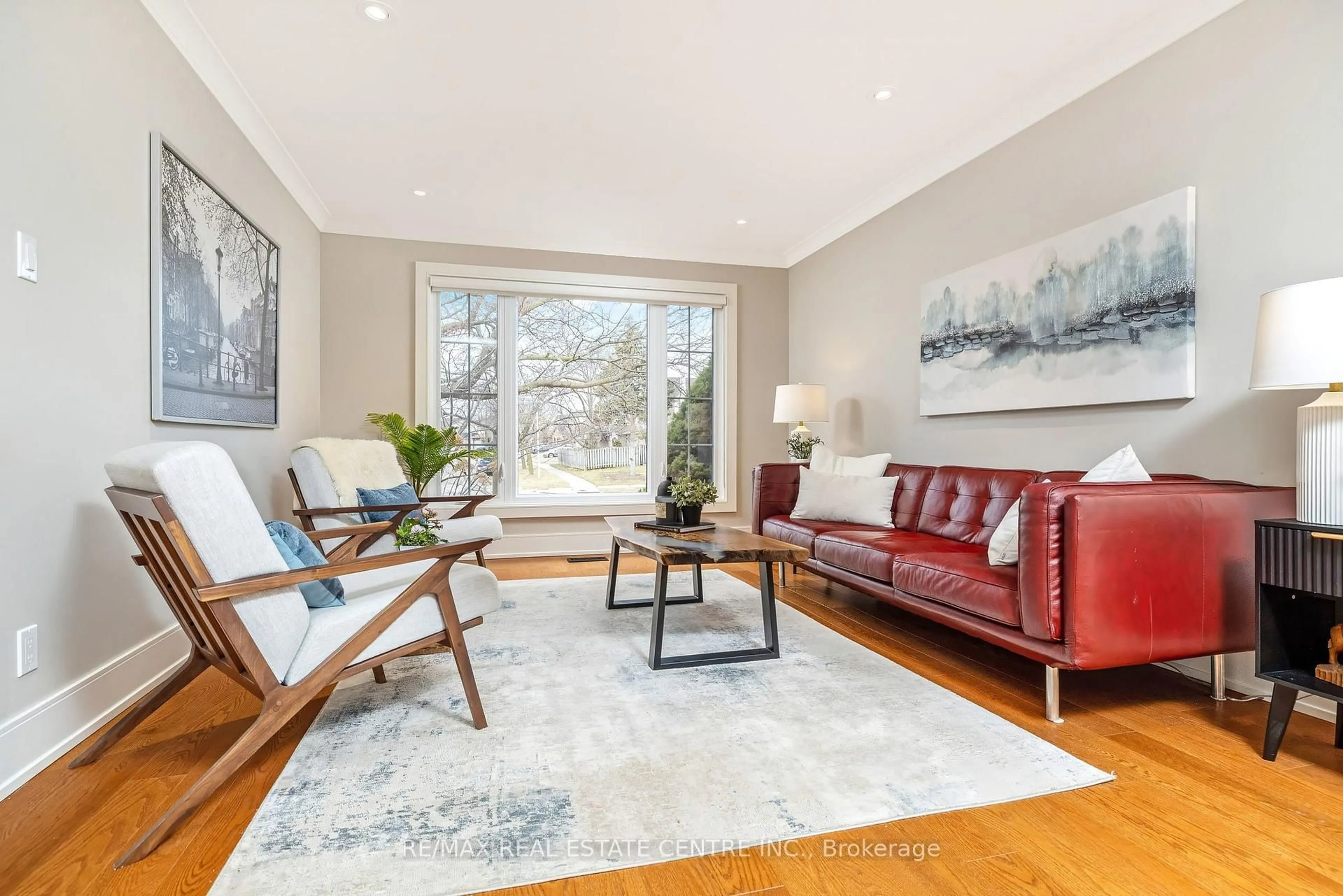 Living room with furniture, wood/laminate floor for 517 Farmstead Dr, Milton Ontario L9T 4N7