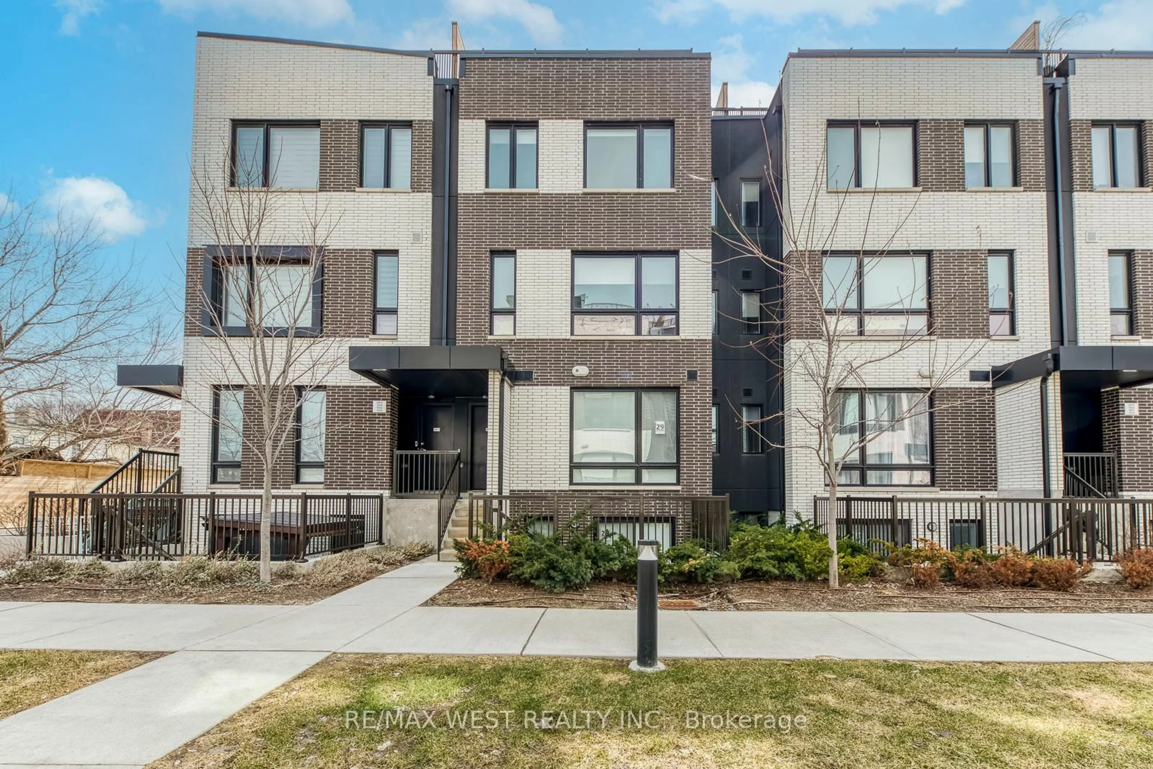 Home with brick exterior material, street for 20 Ed Clark Gdns #14, Toronto Ontario M6N 0B5