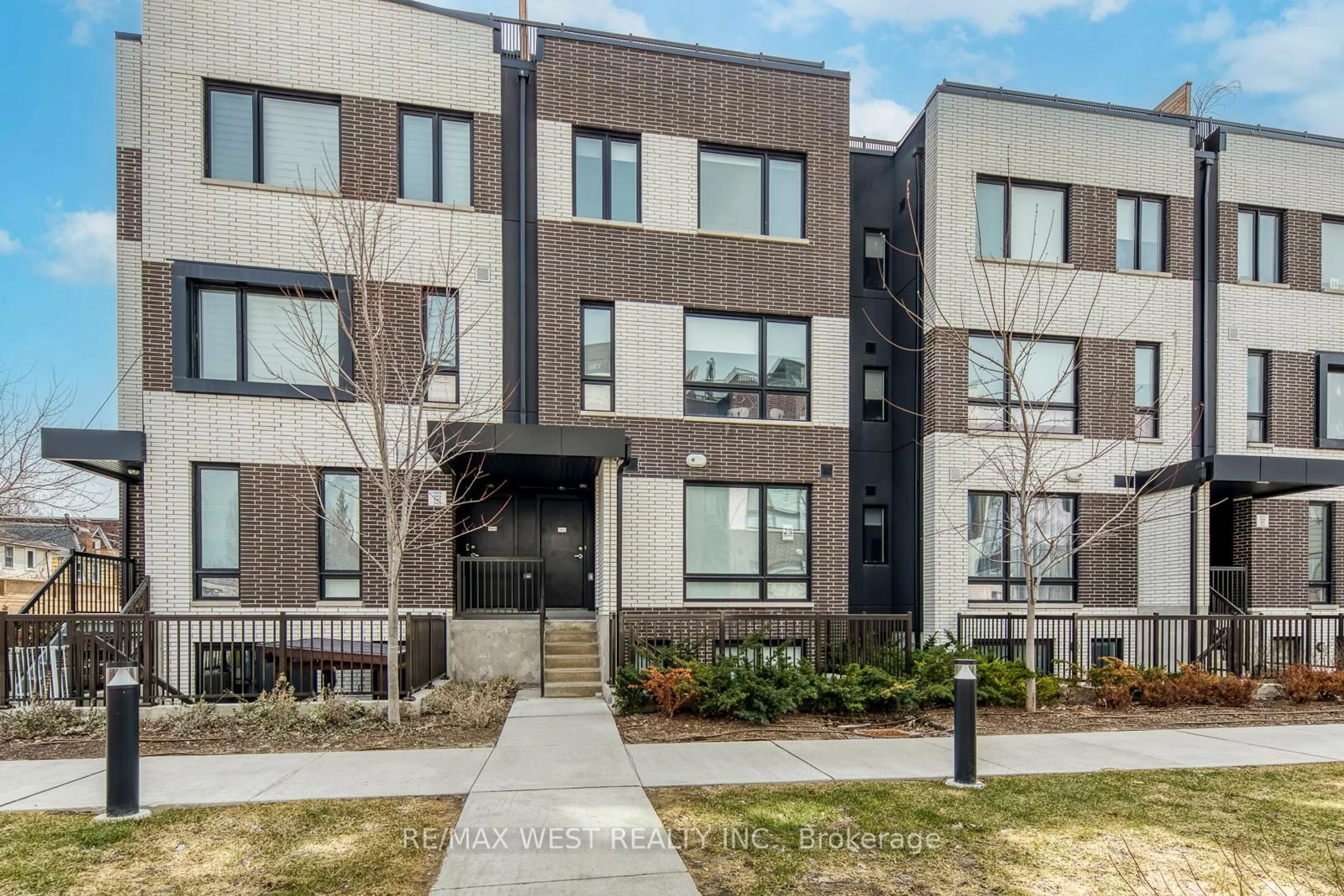 Home with brick exterior material, street for 20 Ed Clark Gdns #14, Toronto Ontario M6N 0B5