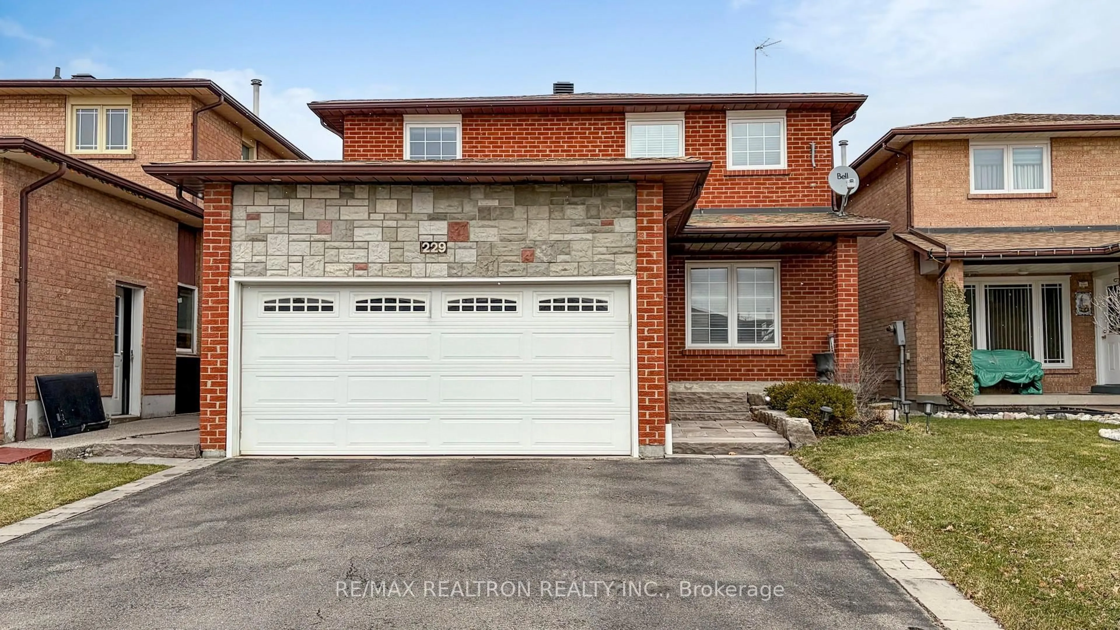 Home with brick exterior material, street for 229 Kingsbridge Garden Circ, Mississauga Ontario L5R 1L4