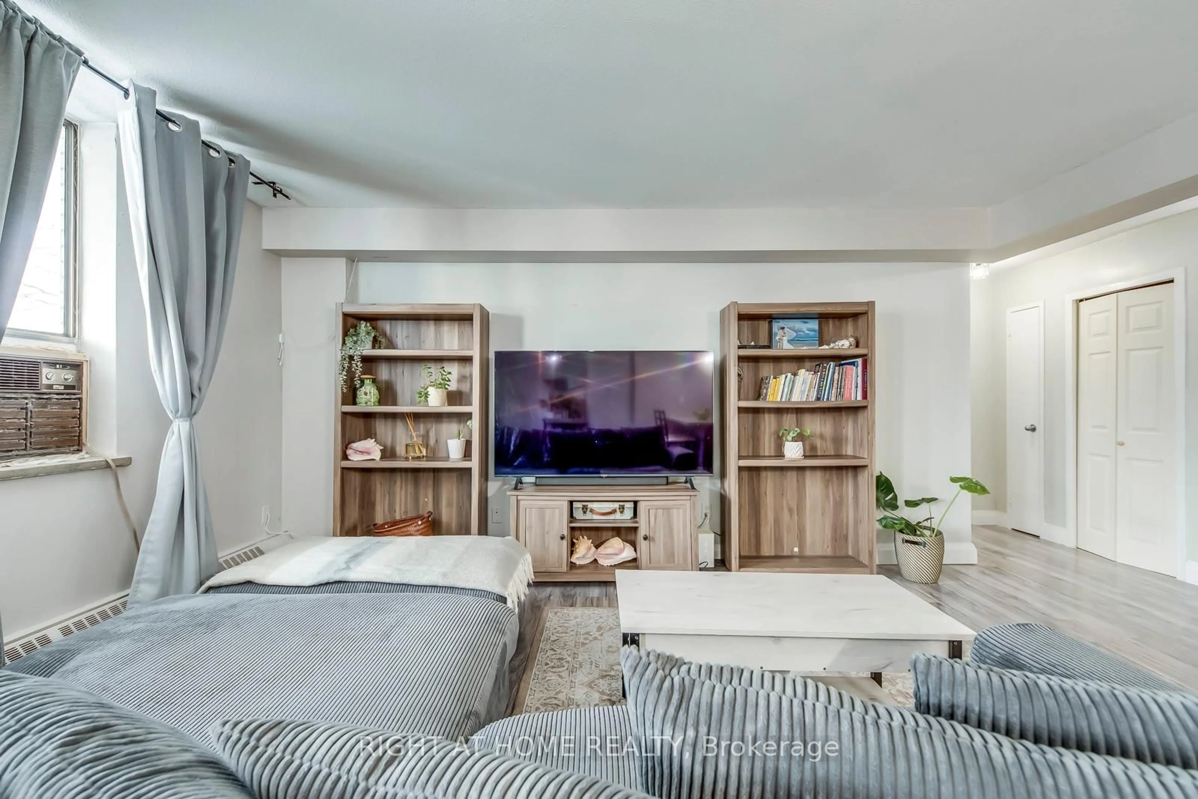 Living room with furniture, unknown for 3460 Keele St #103, Toronto Ontario M3J 1L9