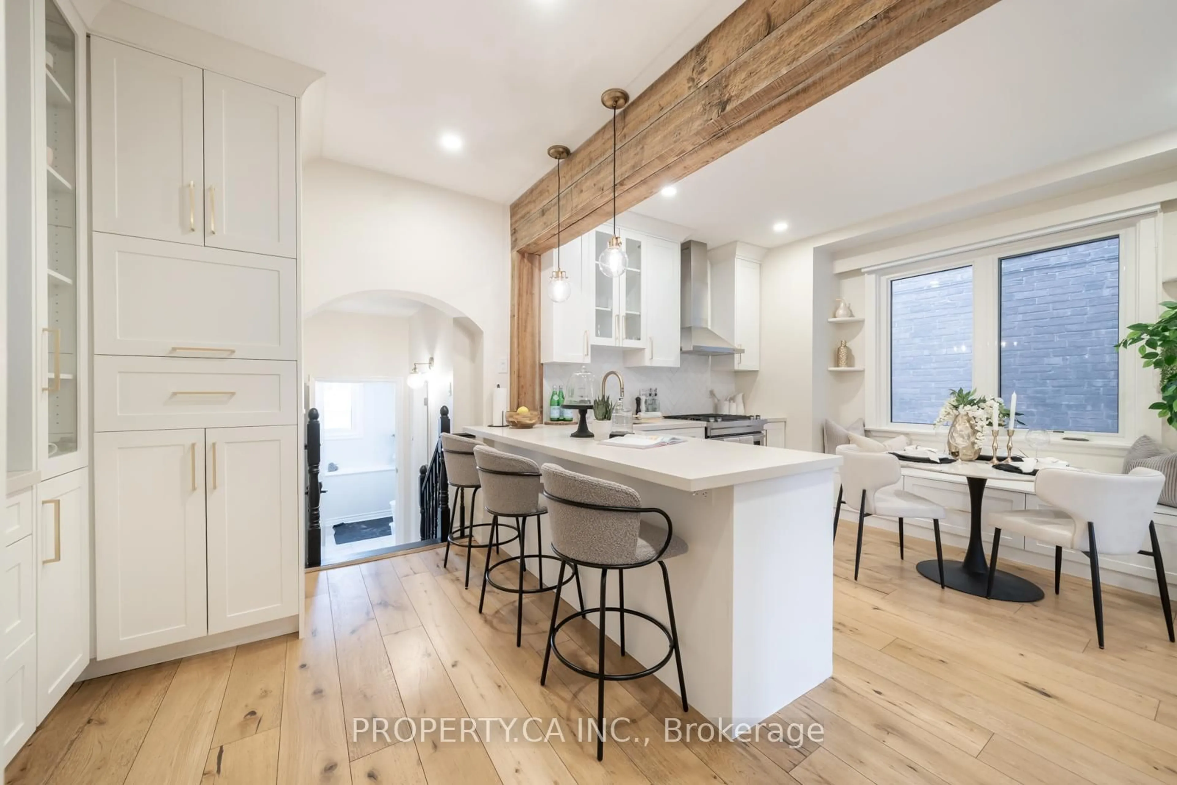 Open concept kitchen, wood/laminate floor for 135 Sellers Ave, Toronto Ontario M6E 3V1