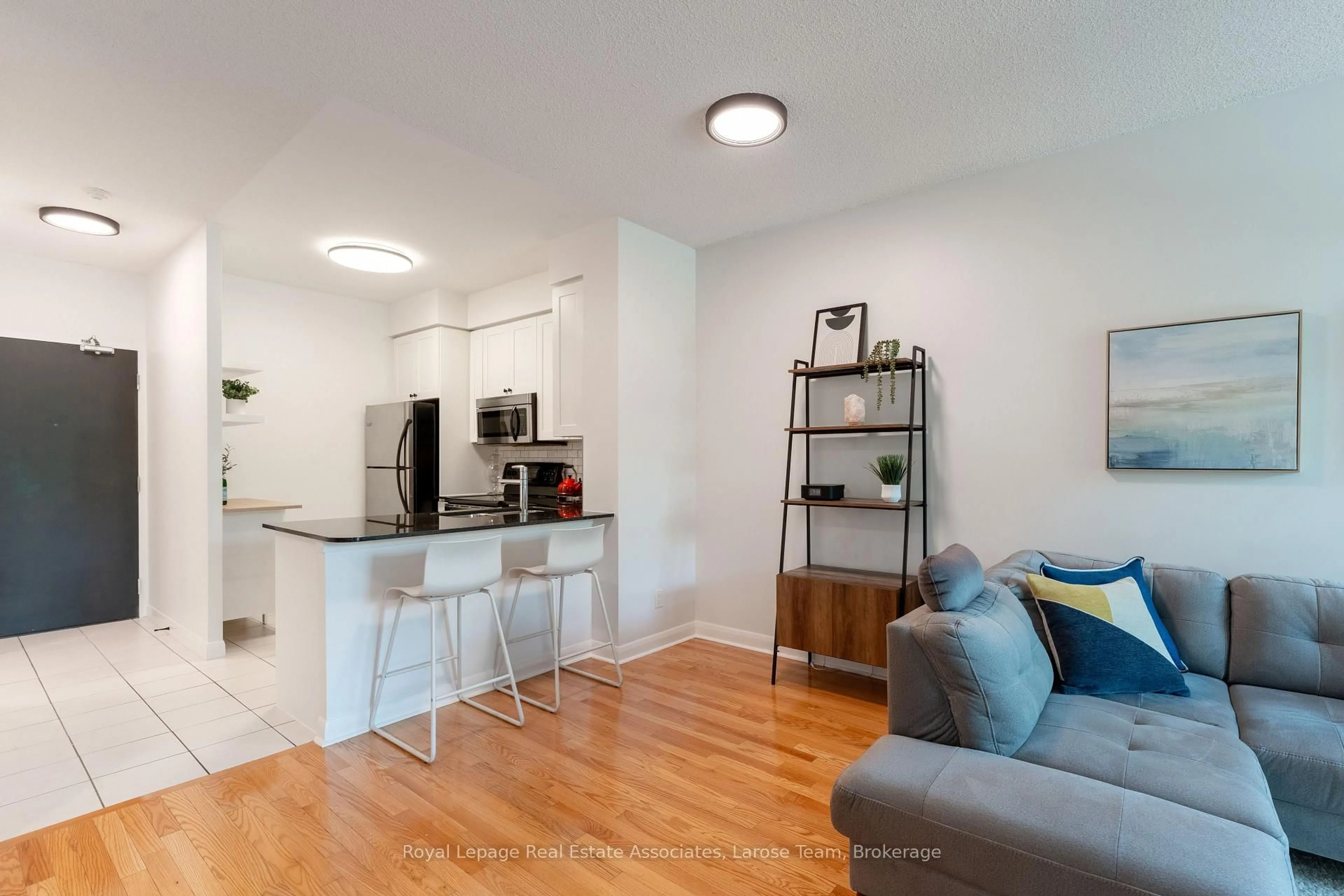 Open concept kitchen, wood/laminate floor for 225 Sherway Gardens Rd #102, Toronto Ontario M9C 0A3