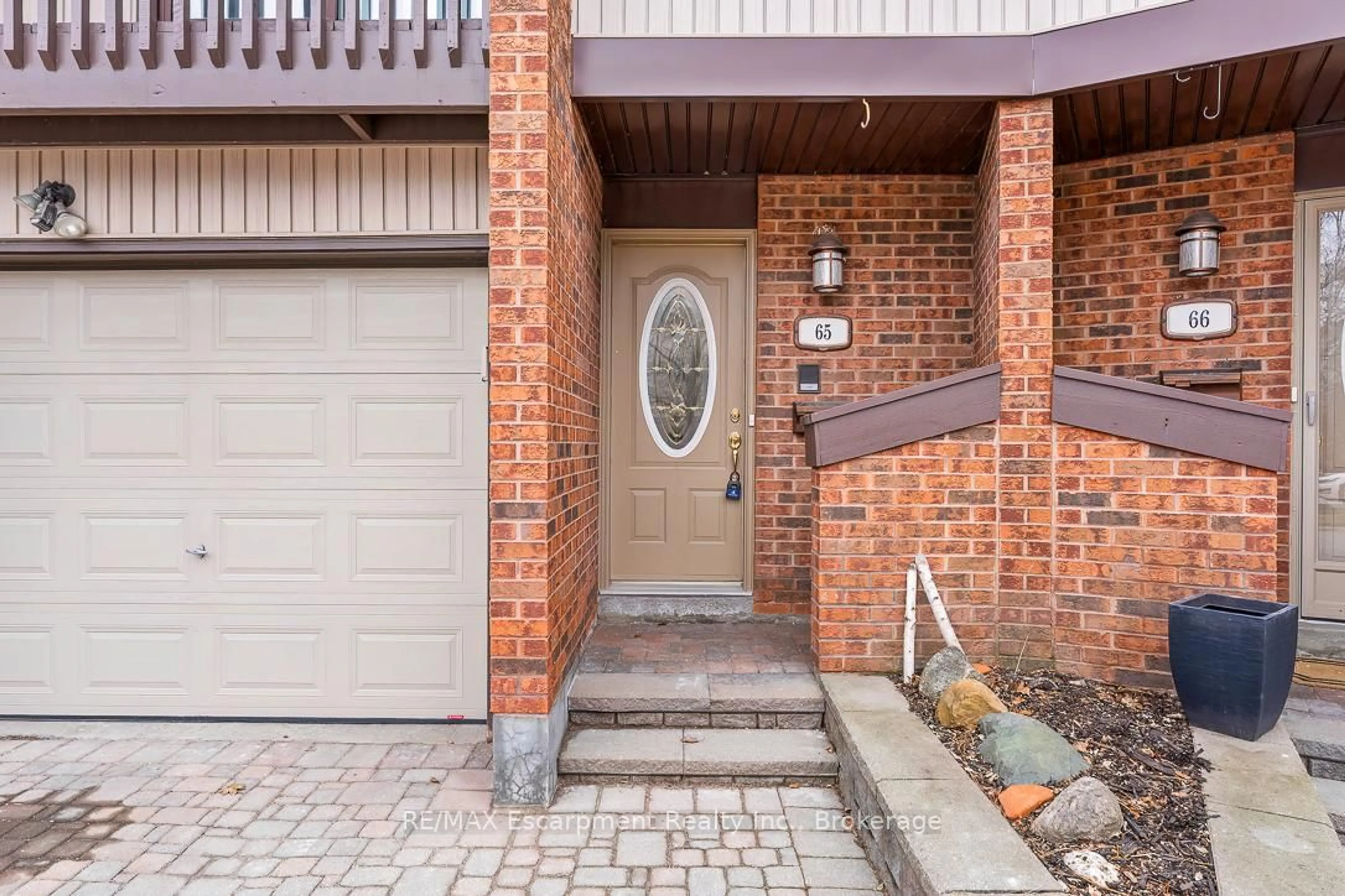 Home with brick exterior material, street for 1080 WALDEN Circ #65, Mississauga Ontario L5J 4J9