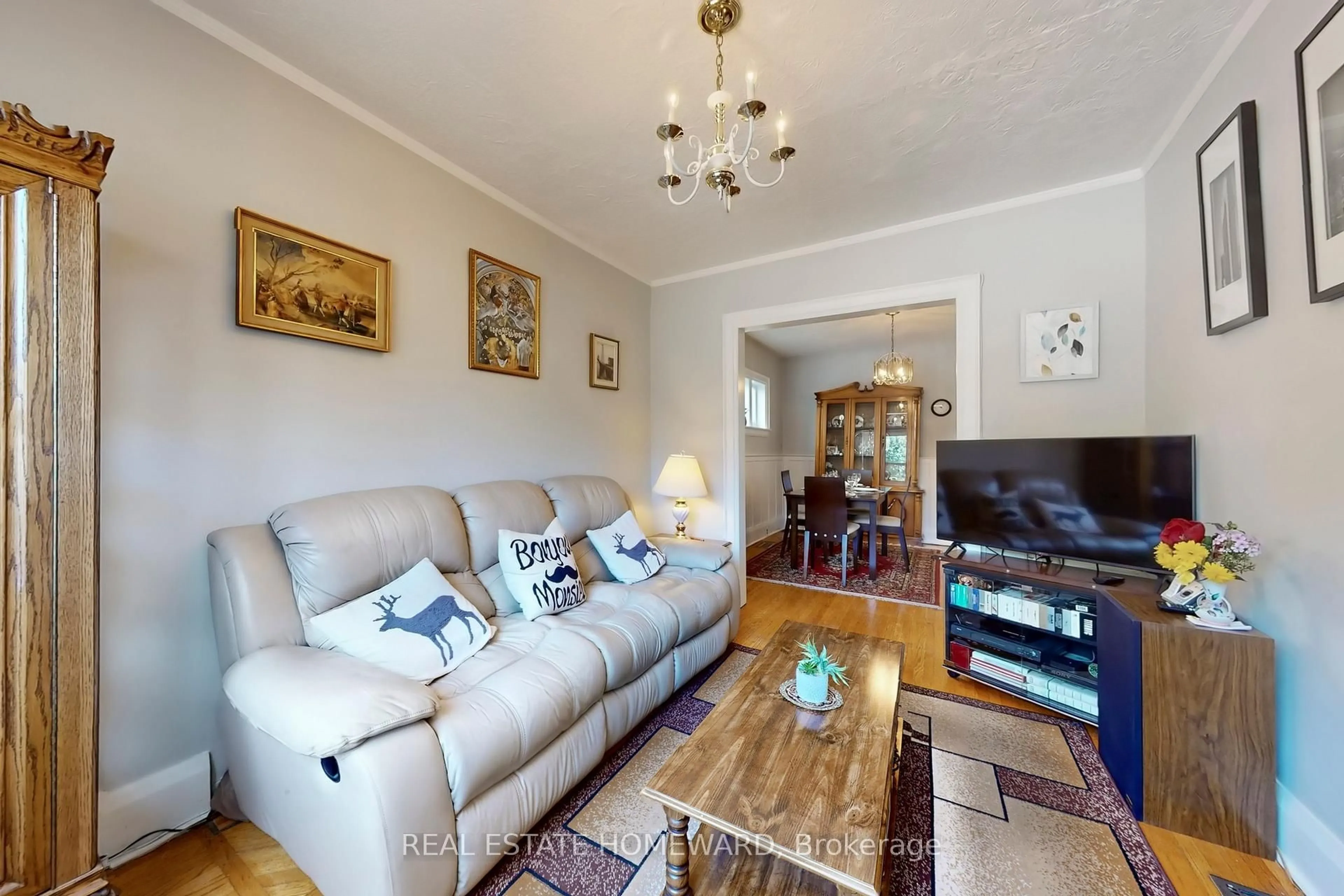 Living room with furniture, wood/laminate floor for 87 Guestville Ave, Toronto Ontario M6N 4N5