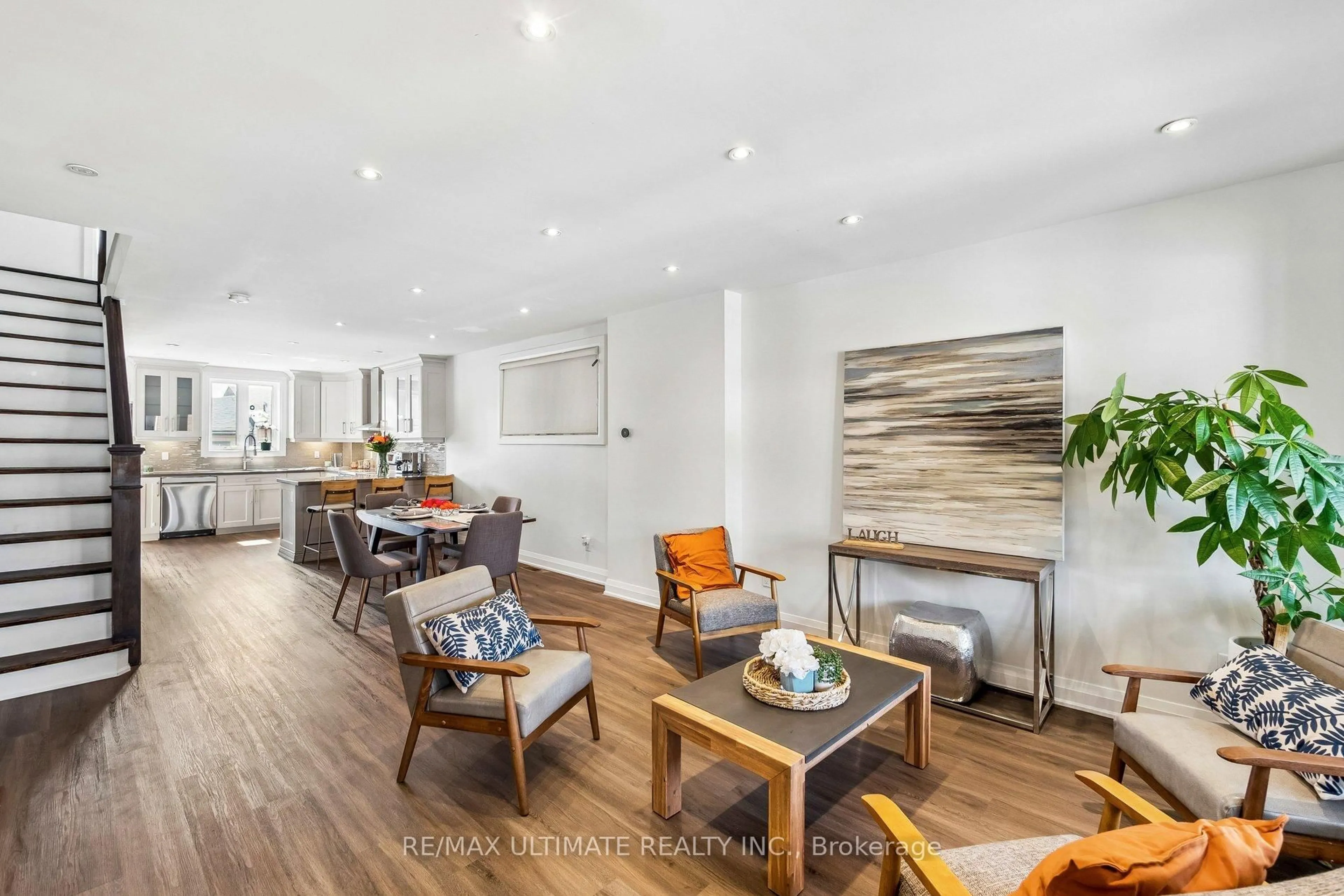 Living room with furniture, wood/laminate floor for 155 Morrison Ave, Toronto Ontario M6E 1M6