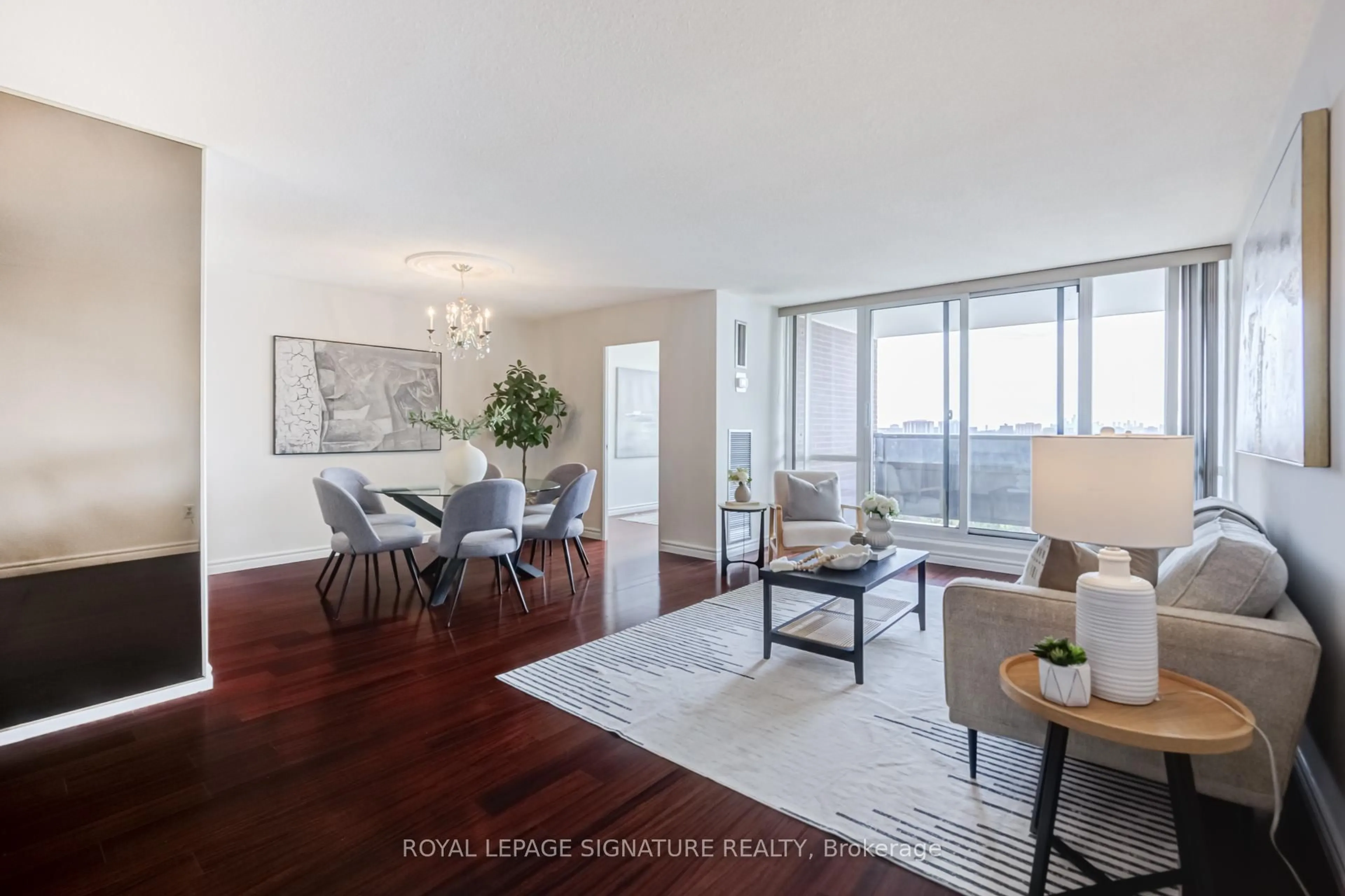 Living room with furniture, wood/laminate floor for 625 The West Mall #901, Toronto Ontario M9C 4W9