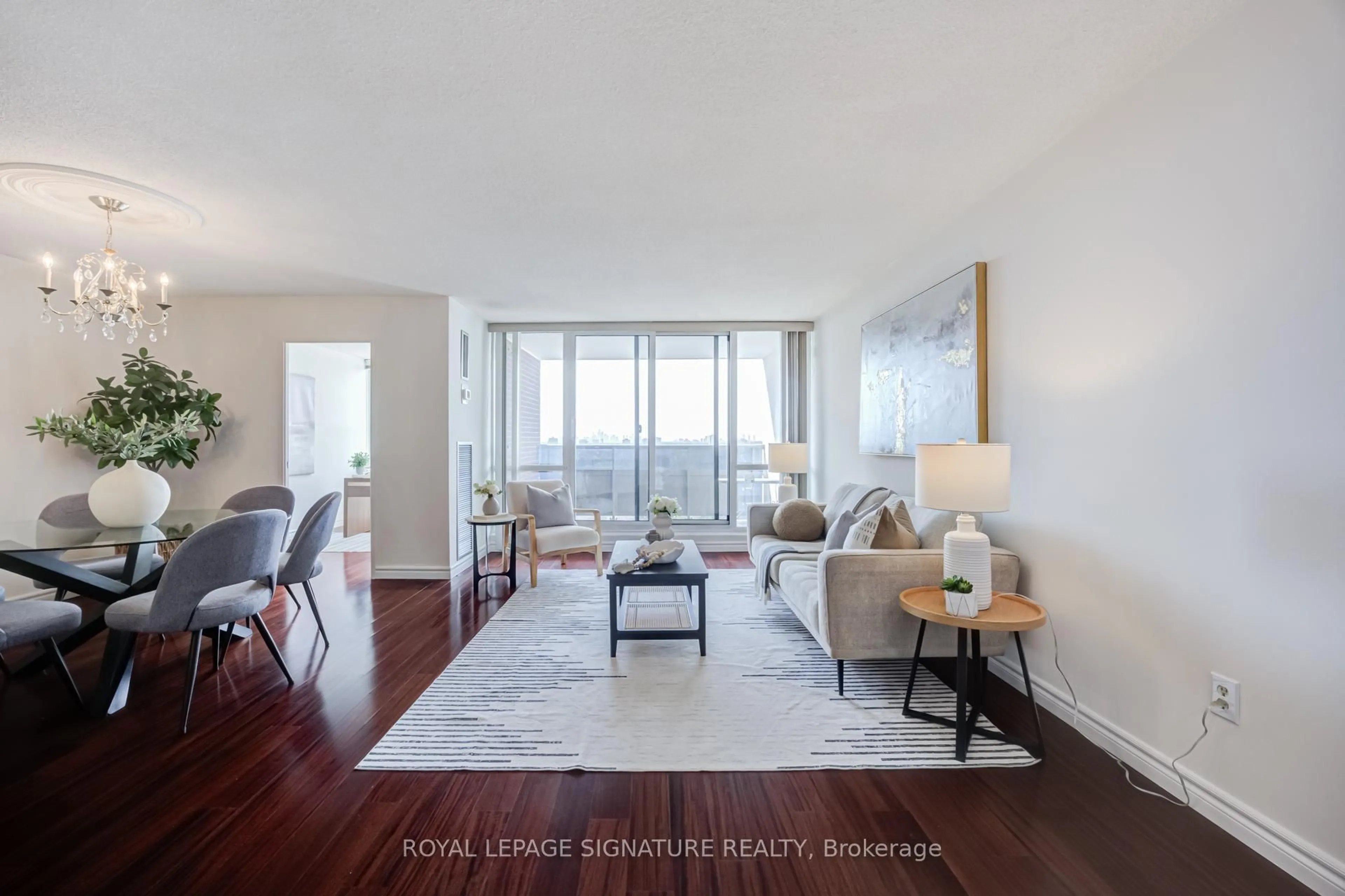 Living room with furniture, wood/laminate floor for 625 The West Mall #901, Toronto Ontario M9C 4W9