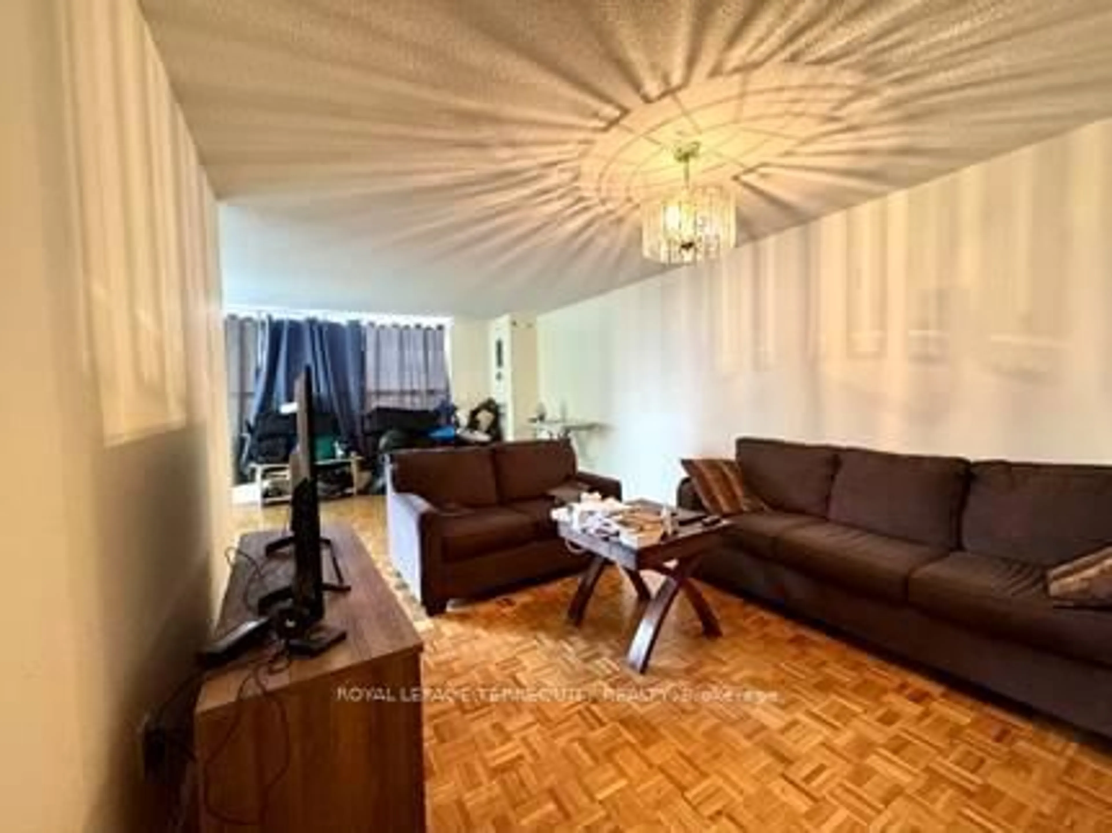 Living room with furniture, wood/laminate floor for 40 Panorama Crt #605, Toronto Ontario M9V 4M1