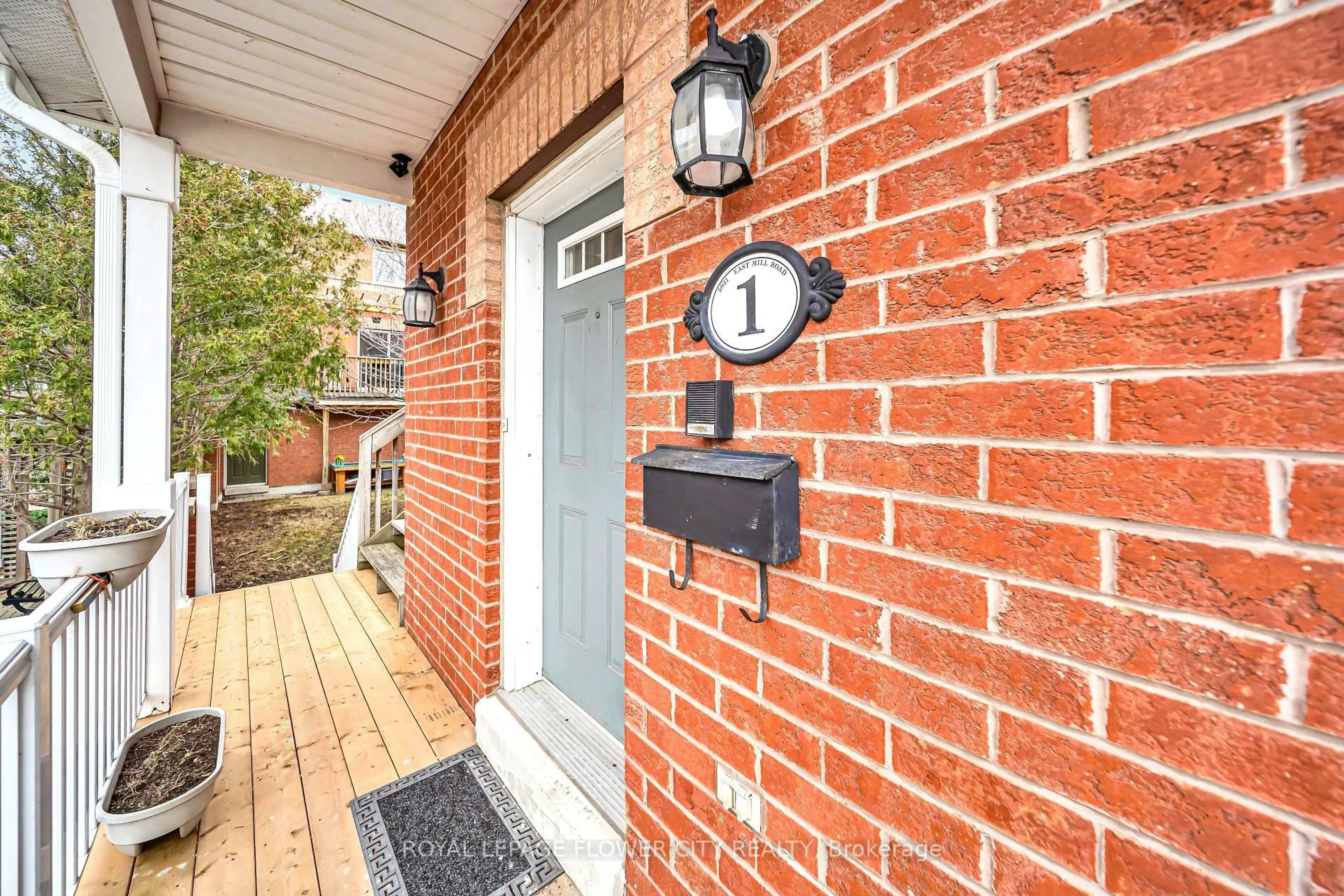 Home with brick exterior material, street for 5031 E Mill Rd #1, Mississauga Ontario L5V 2M5