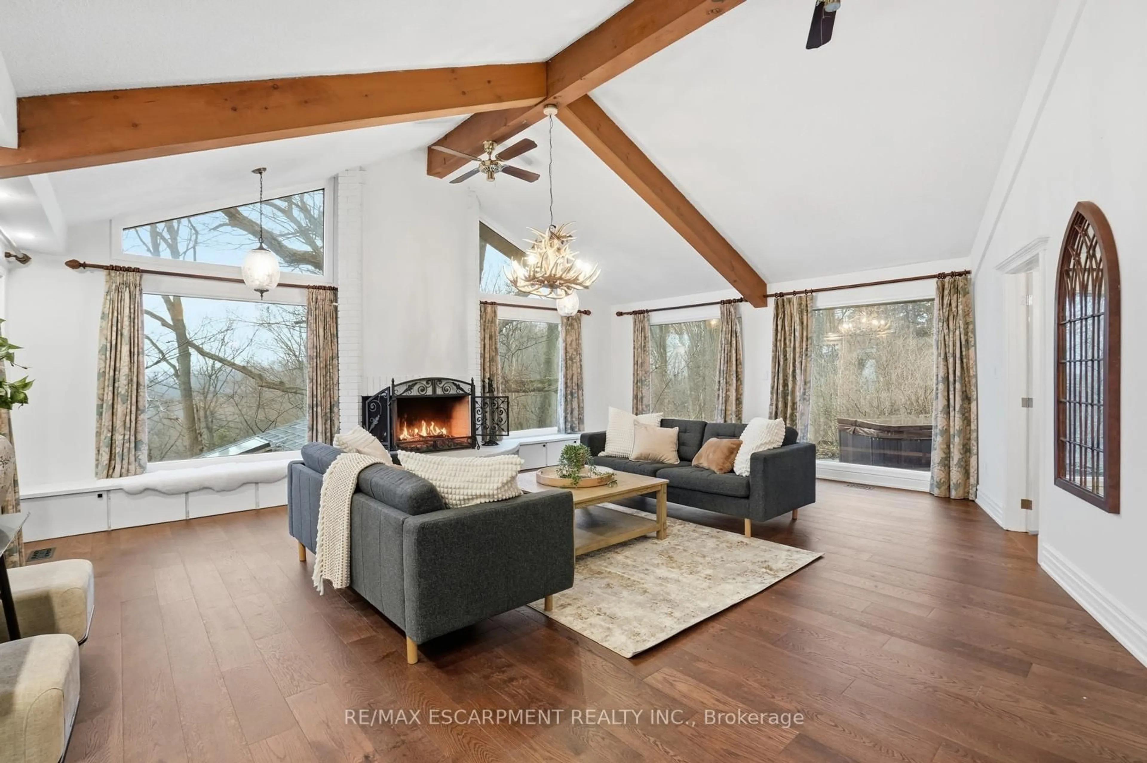 Living room with furniture, wood/laminate floor for 1987 Snake Rd, Burlington Ontario L7P 4Y1