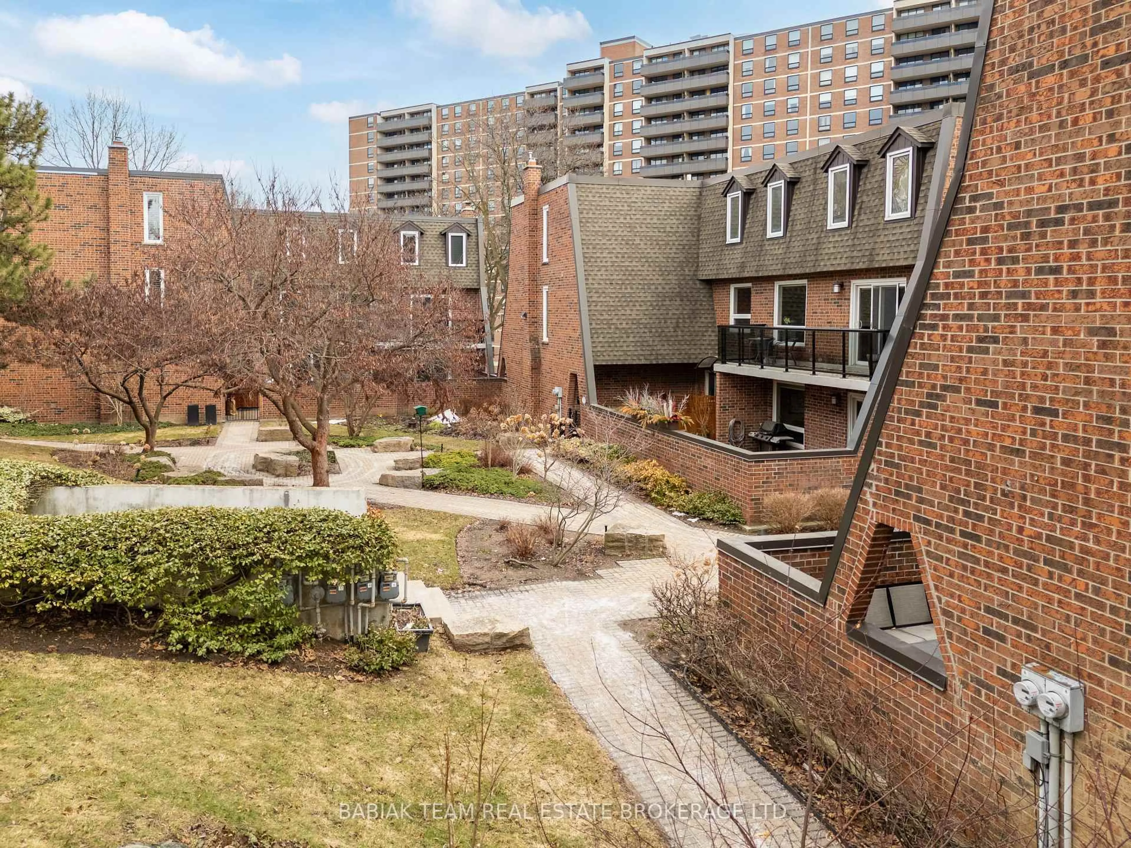 Patio, city buildings view from balcony for 22 La Rose Ave #TH7, Toronto Ontario M9P 1A5