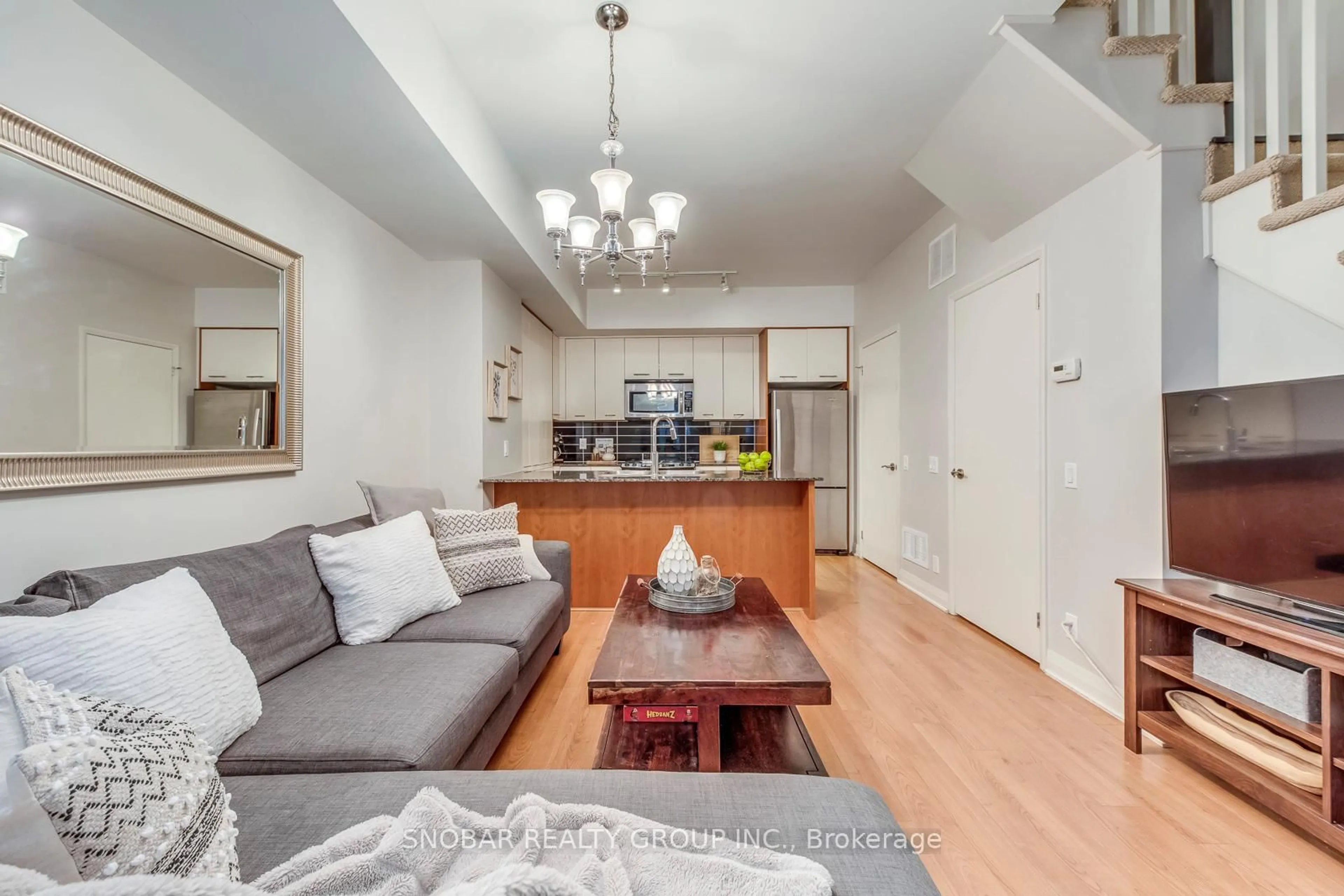 Living room with furniture, wood/laminate floor for 19 Valhalla Inn Rd #21, Toronto Ontario M9B 0B3