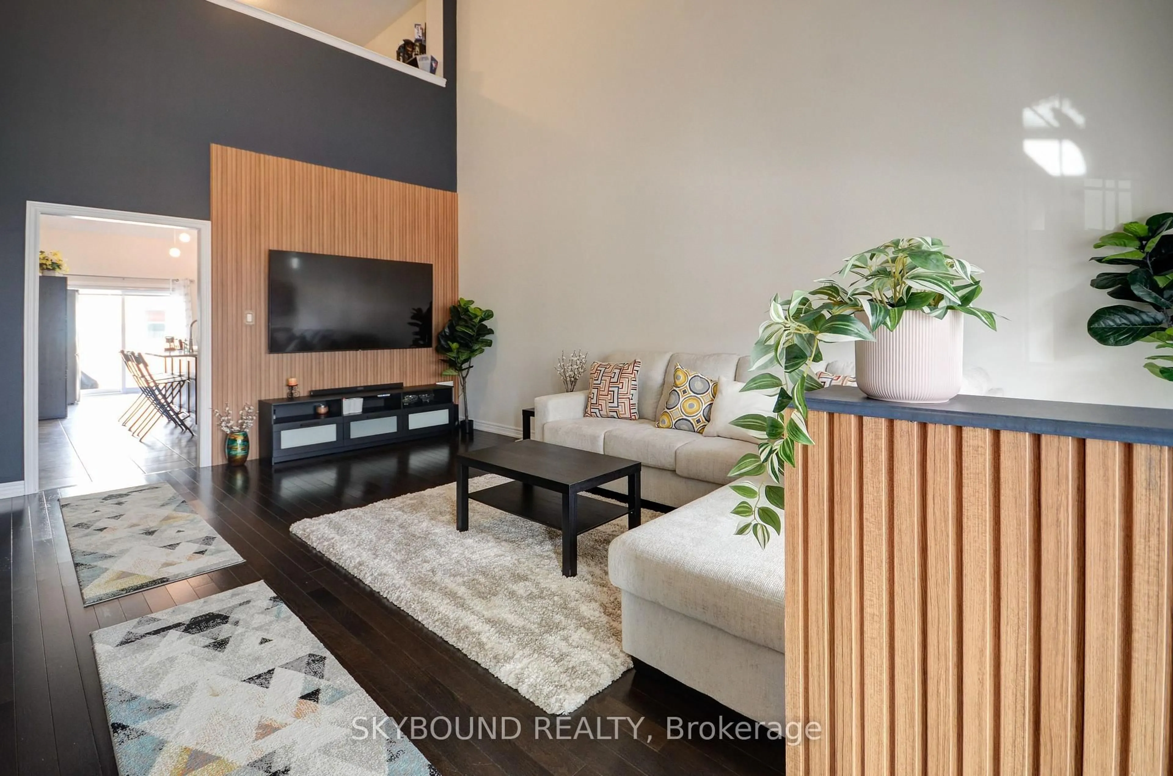 Living room with furniture, wood/laminate floor for 11 Alamode Rd #30, Brampton Ontario L6R 3Z8