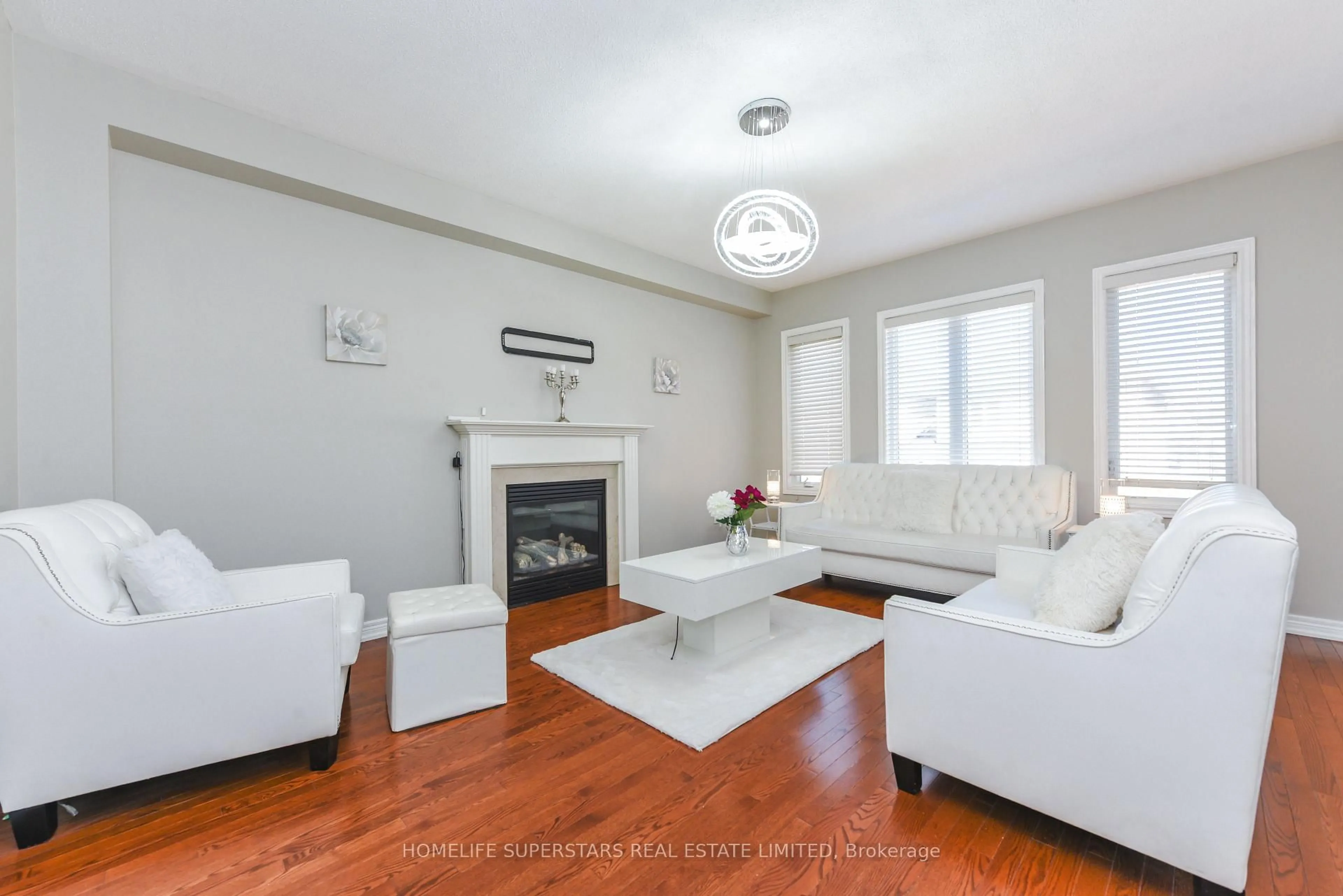 Living room with furniture, wood/laminate floor for 5 Amy Ave, Brampton Ontario L6P 3L7