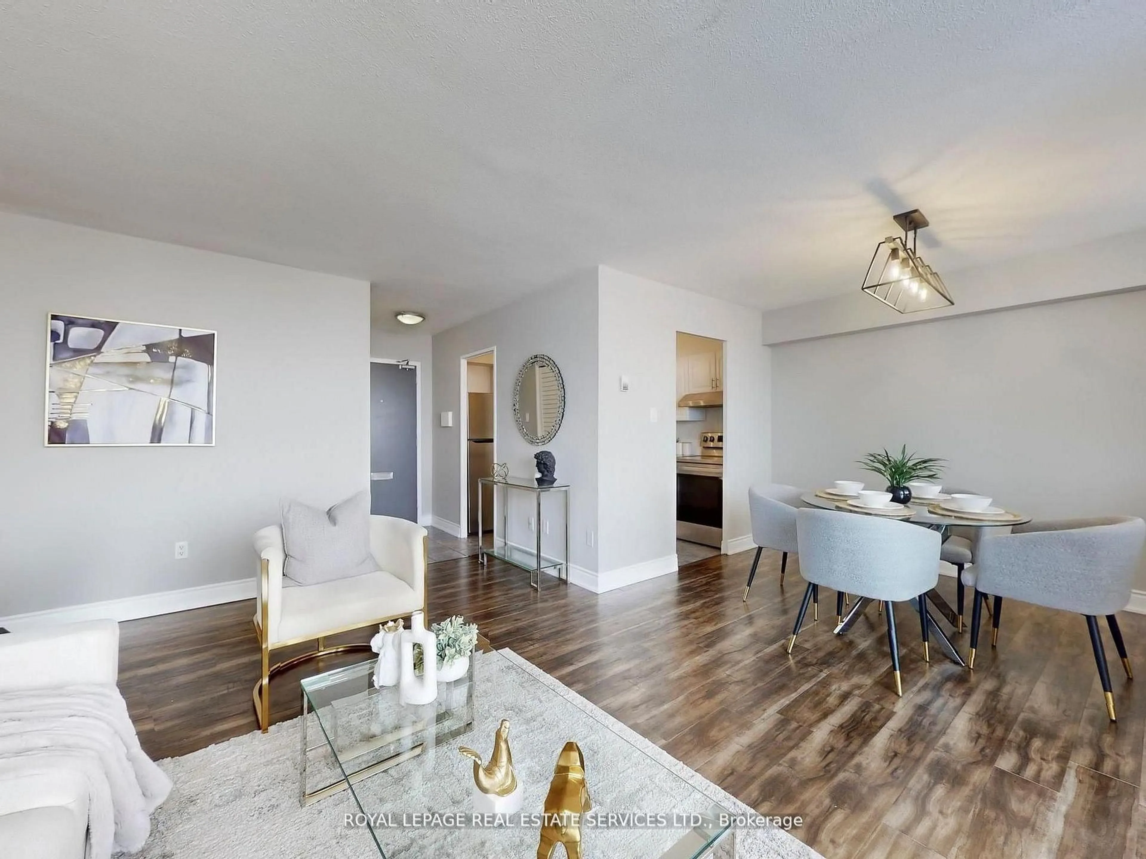 Living room with furniture, wood/laminate floor for 551 The West Mall #702, Toronto Ontario M9C 1G7