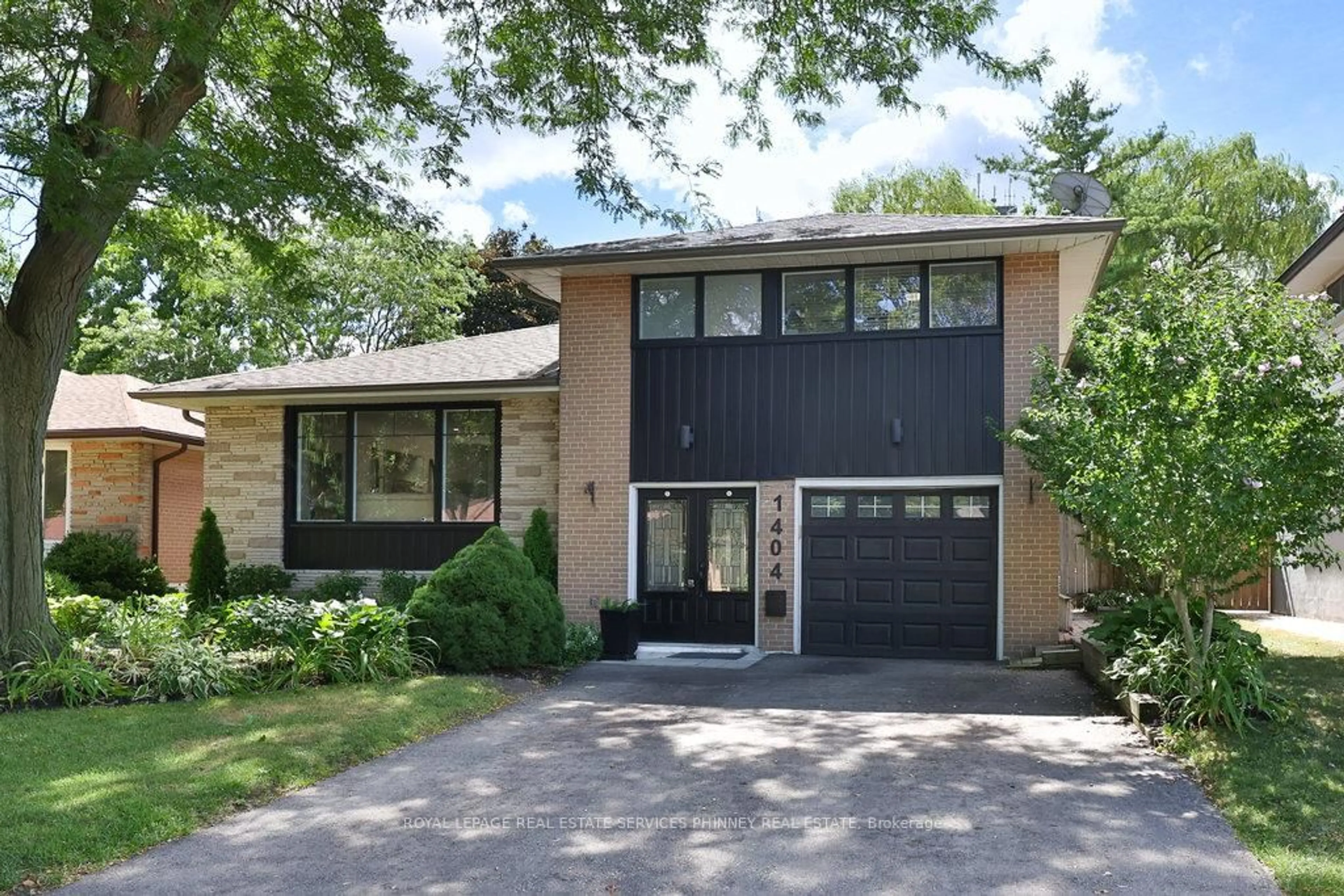 Home with brick exterior material, street for 1404 Lewisham Dr, Mississauga Ontario L5J 3R3