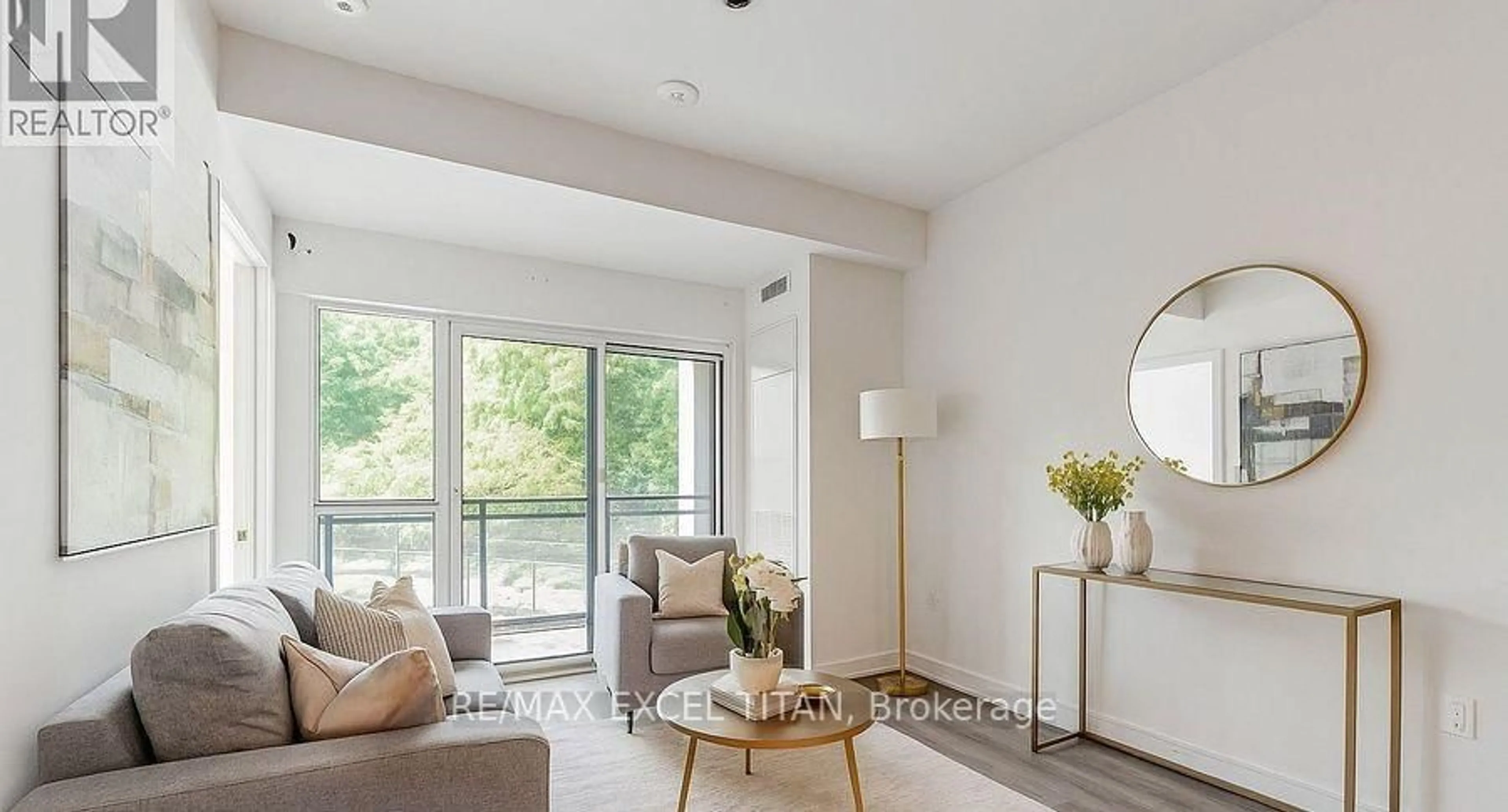 Living room with furniture, wood/laminate floor for 25 Neighbourhood Lane #205, Toronto Ontario M8Y 0C4