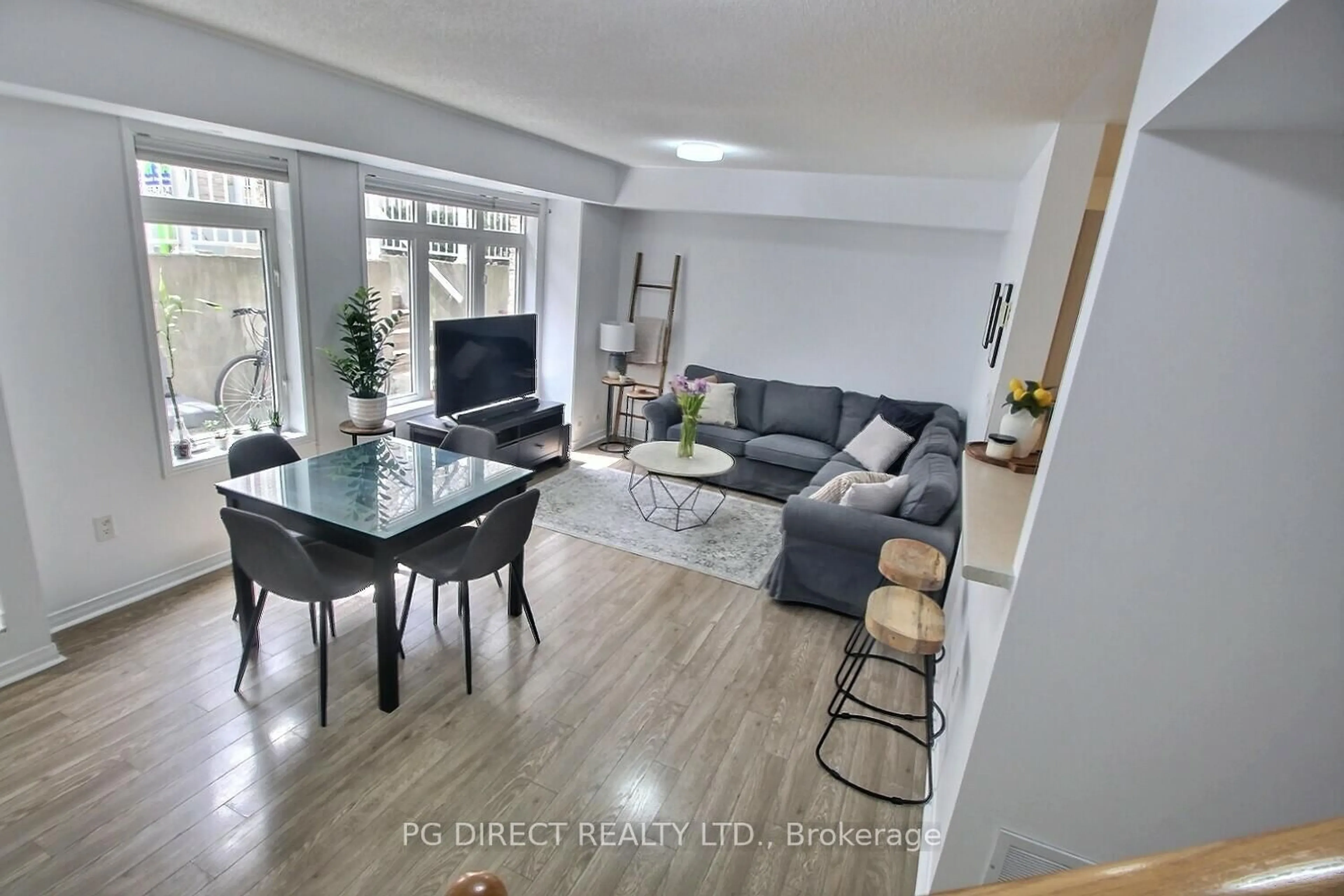 Living room with furniture, unknown for 50 Turntable Cres #57, Toronto Ontario M6H 4K8