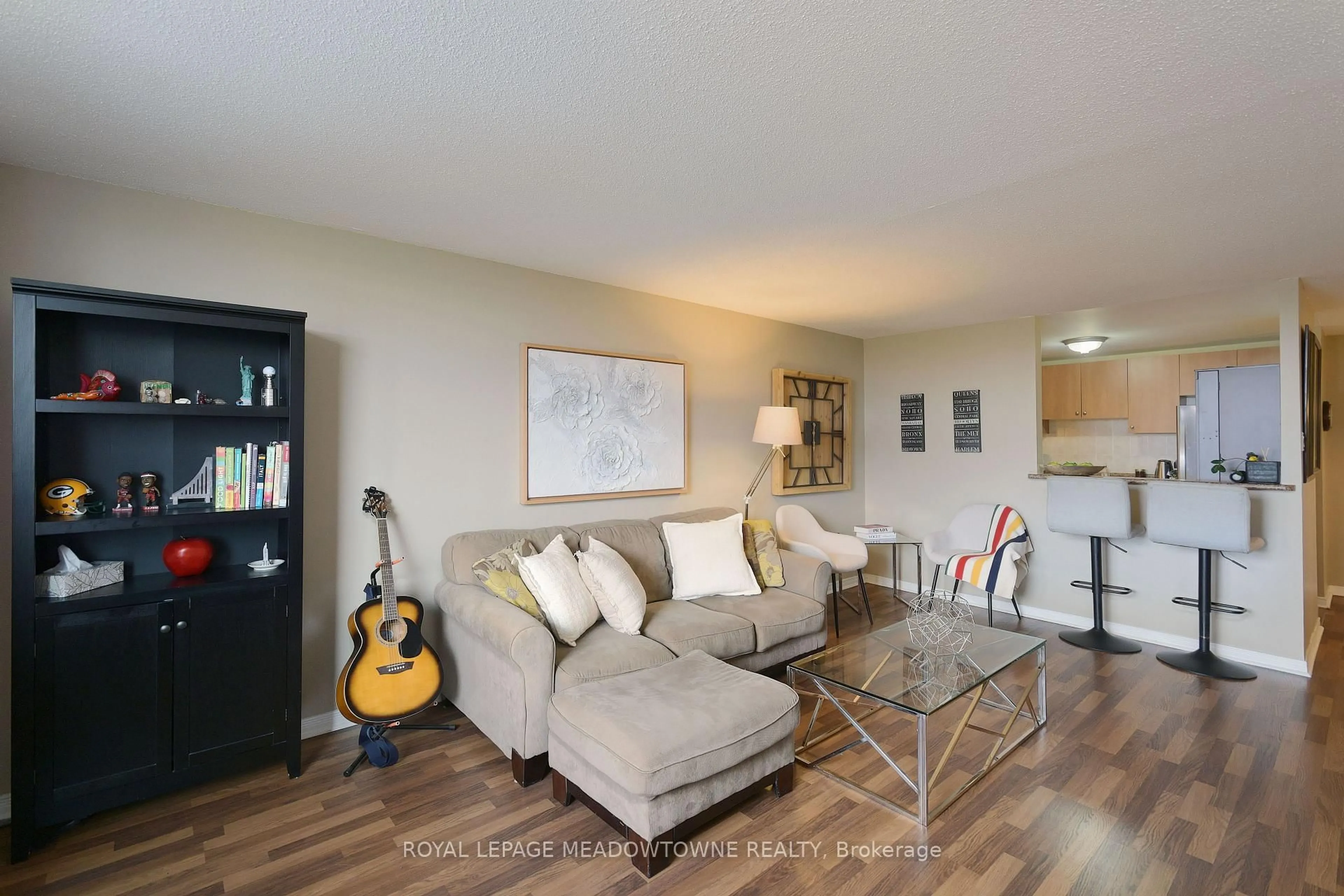 Living room with furniture, wood/laminate floor for 6720 Glen Erin Dr #501, Mississauga Ontario L5N 3K8
