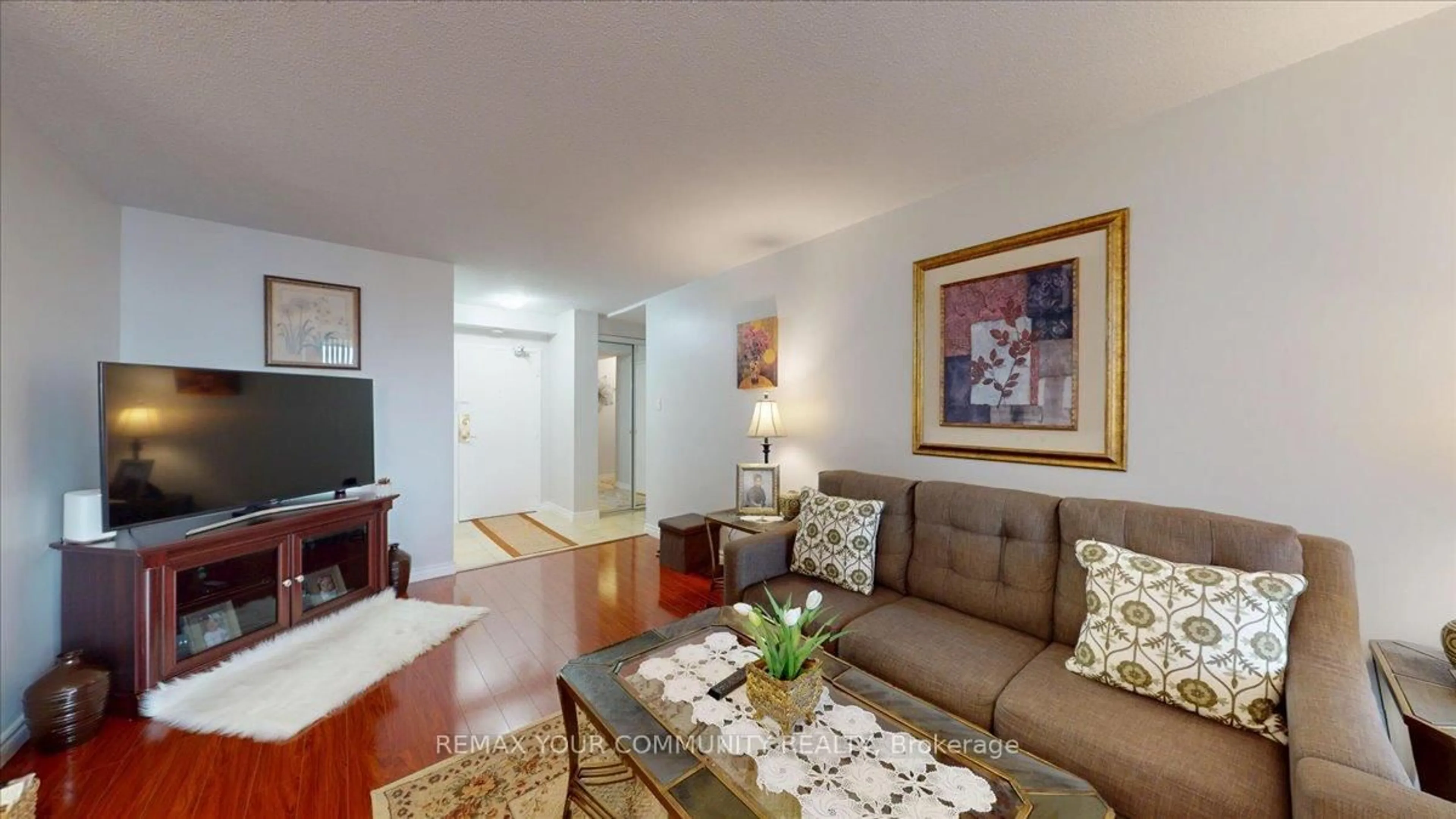 Living room with furniture, wood/laminate floor for 75 Emmett Ave #512, Toronto Ontario M6M 5A7