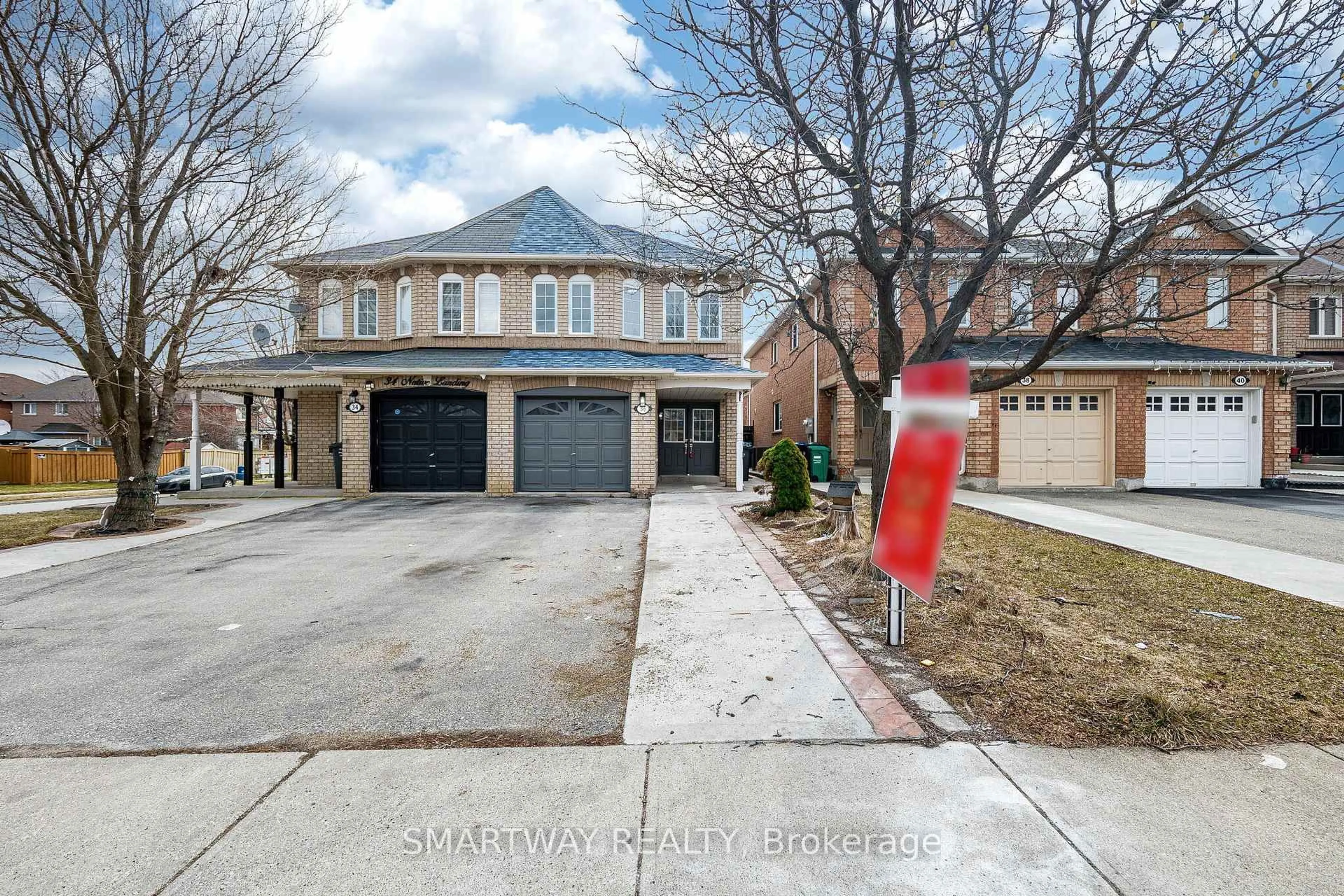 Home with brick exterior material, street for 36 Native Landing, Brampton Ontario L6X 5B1