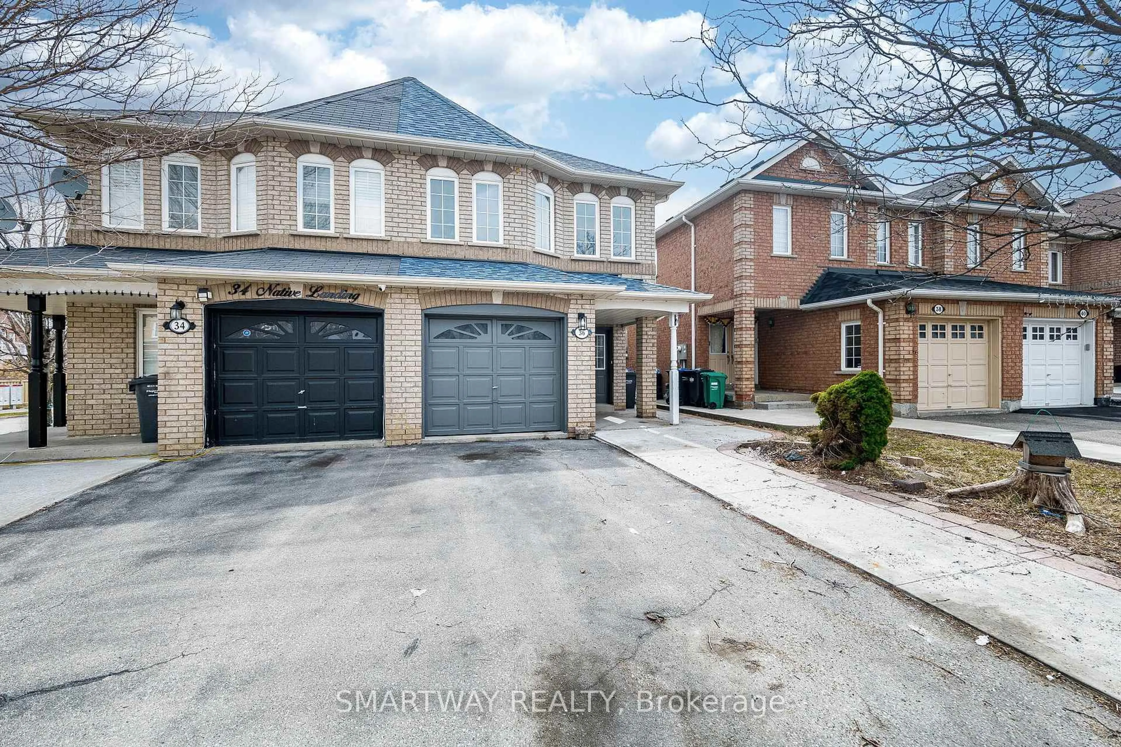 Home with brick exterior material, street for 36 Native Landing, Brampton Ontario L6X 5B1