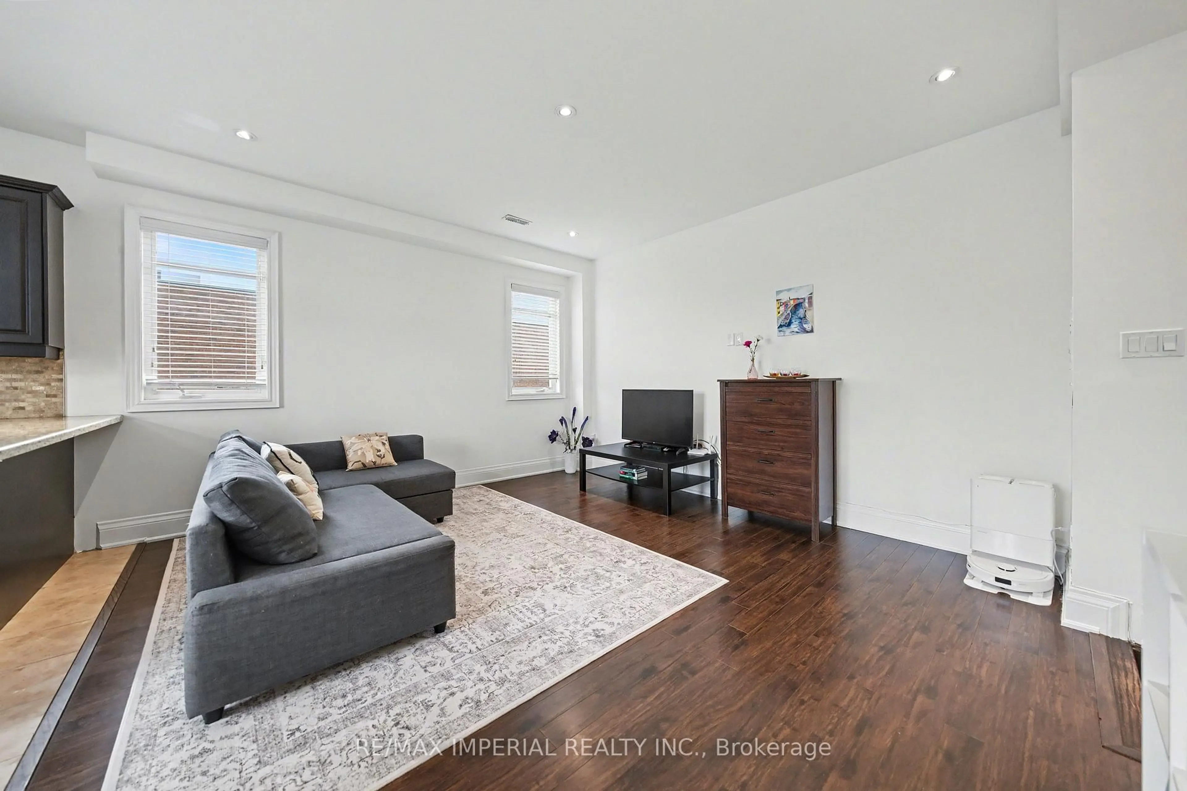 Living room with furniture, wood/laminate floor for 2964 Islington Ave #2, Toronto Ontario M9L 2K6
