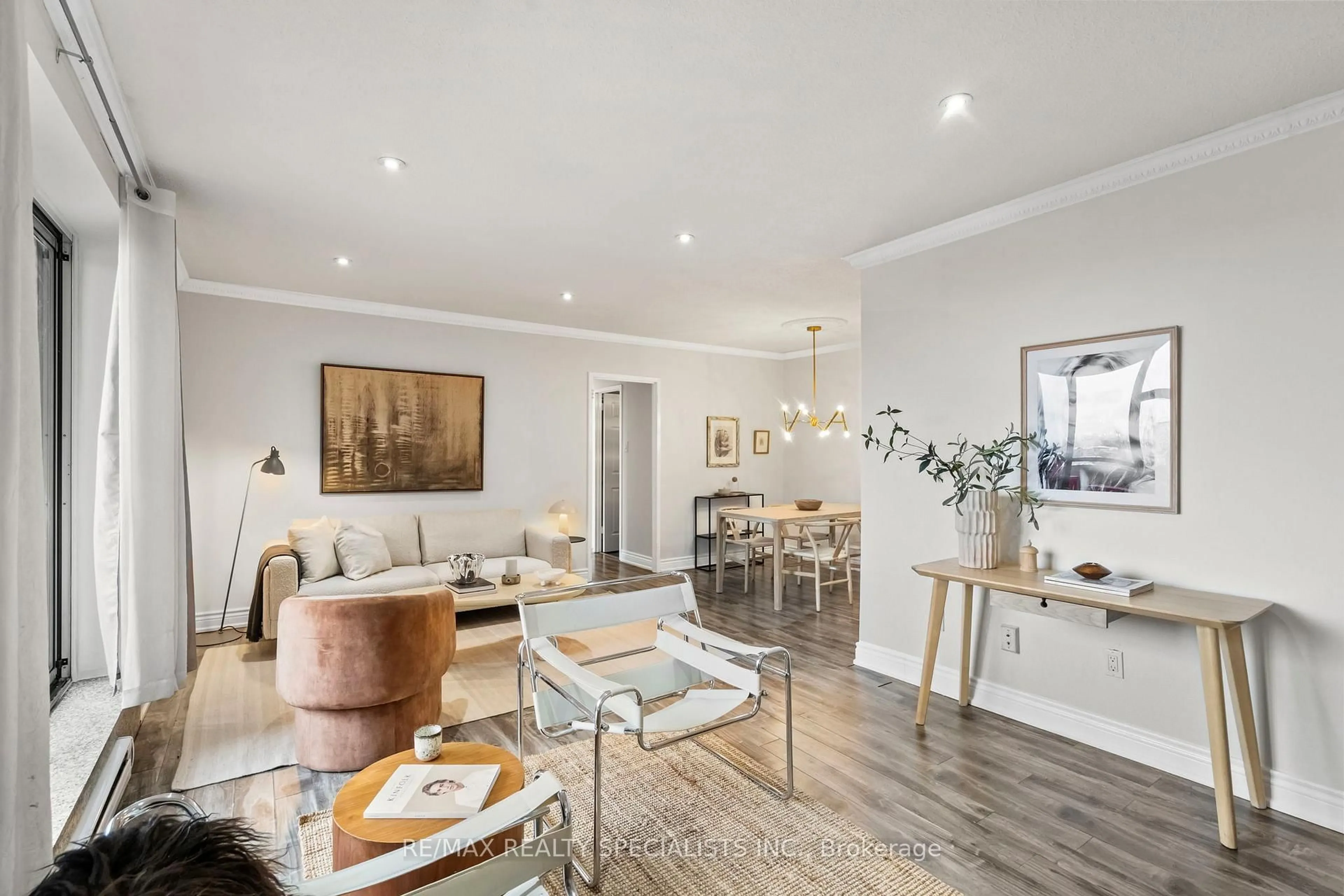 Living room with furniture, wood/laminate floor for 3025 Queen Frederica Dr #602, Mississauga Ontario L4Y 3A1