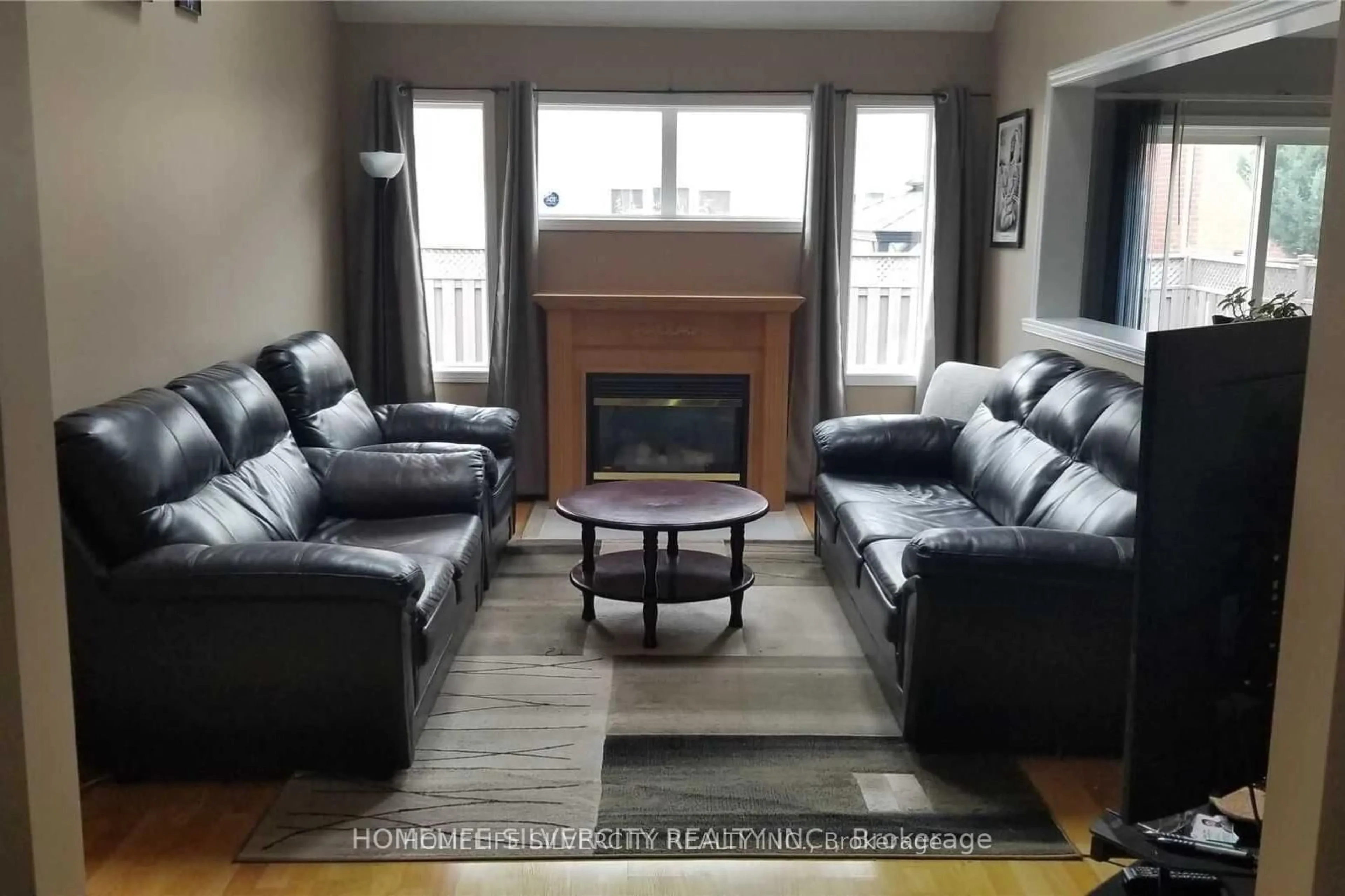 Living room with furniture, wood/laminate floor for 222 Edenbrook Hill Dr, Brampton Ontario L7A 2W7