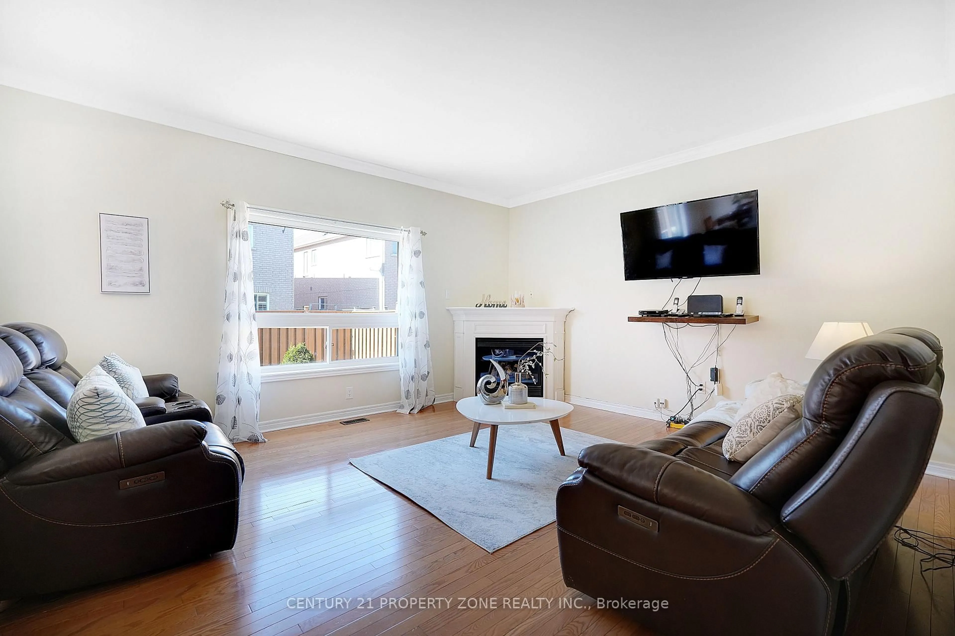 Living room with furniture, wood/laminate floor for 43 Alice Springs Cres, Brampton Ontario L6X 0R7
