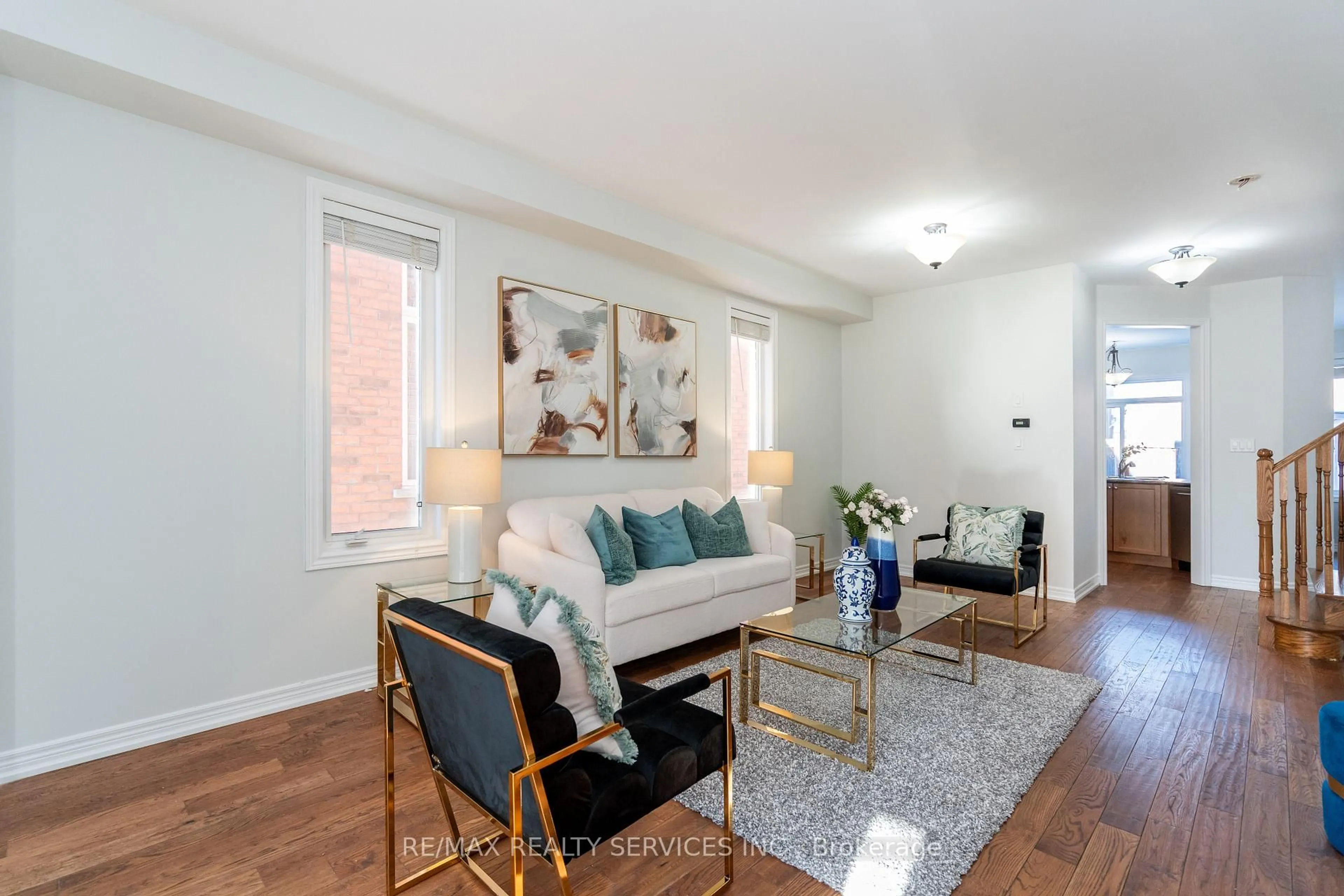 Living room with furniture, wood/laminate floor for 112 Amaranth Cres, Brampton Ontario L7A 0L5