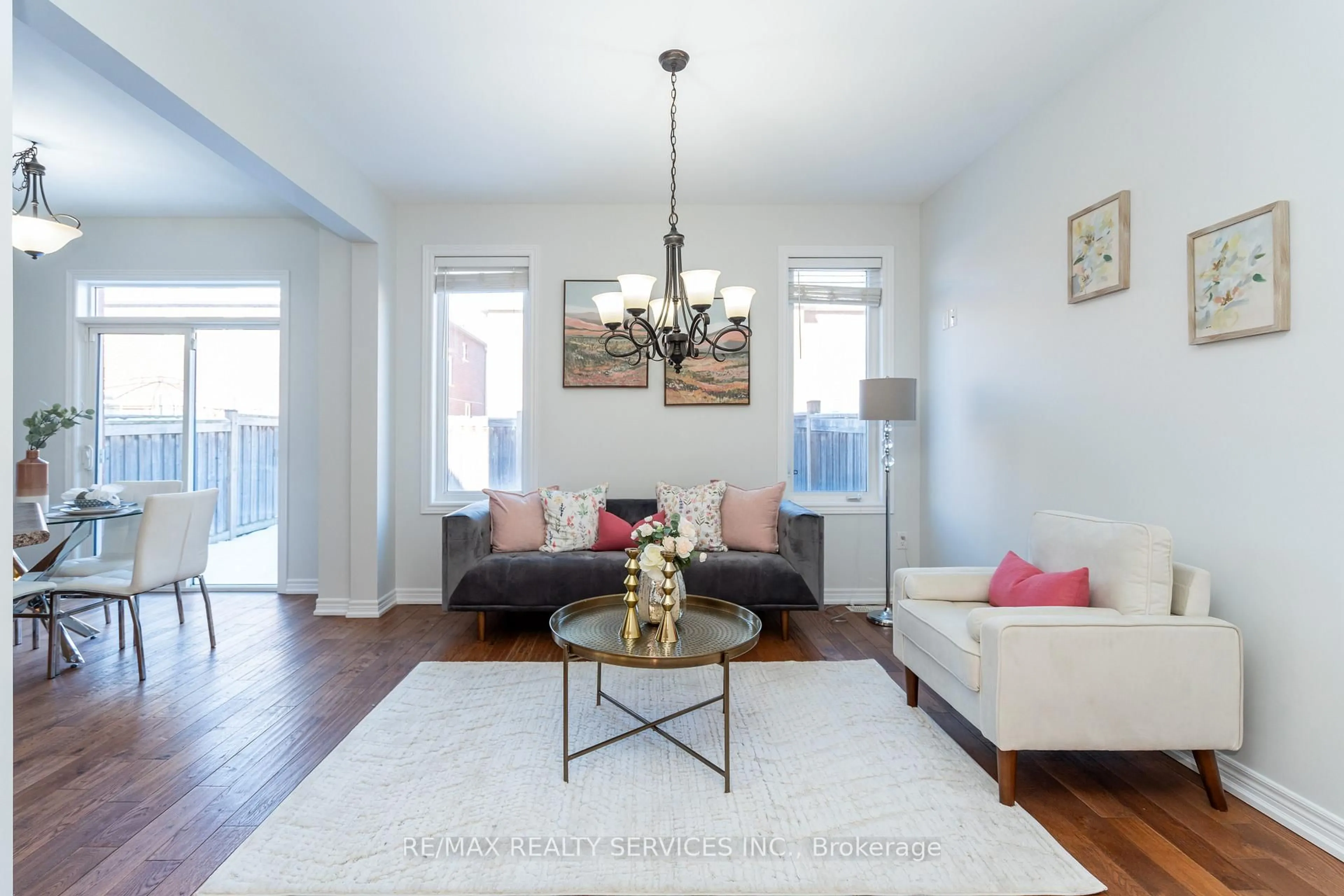 Living room with furniture, wood/laminate floor for 112 Amaranth Cres, Brampton Ontario L7A 0L5