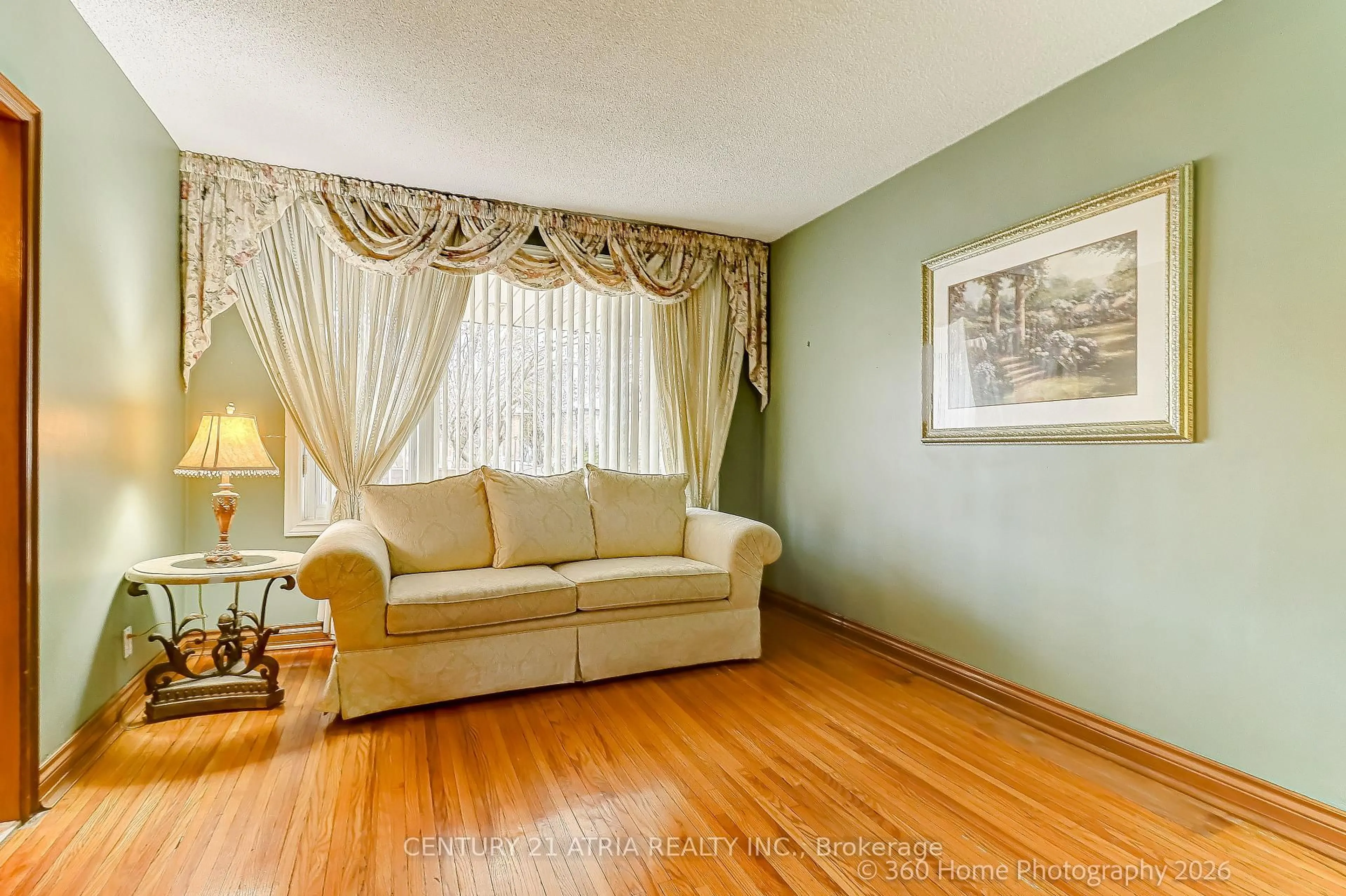 Living room with furniture, wood/laminate floor for 23 Tumpane St, Toronto Ontario M3M 1L5