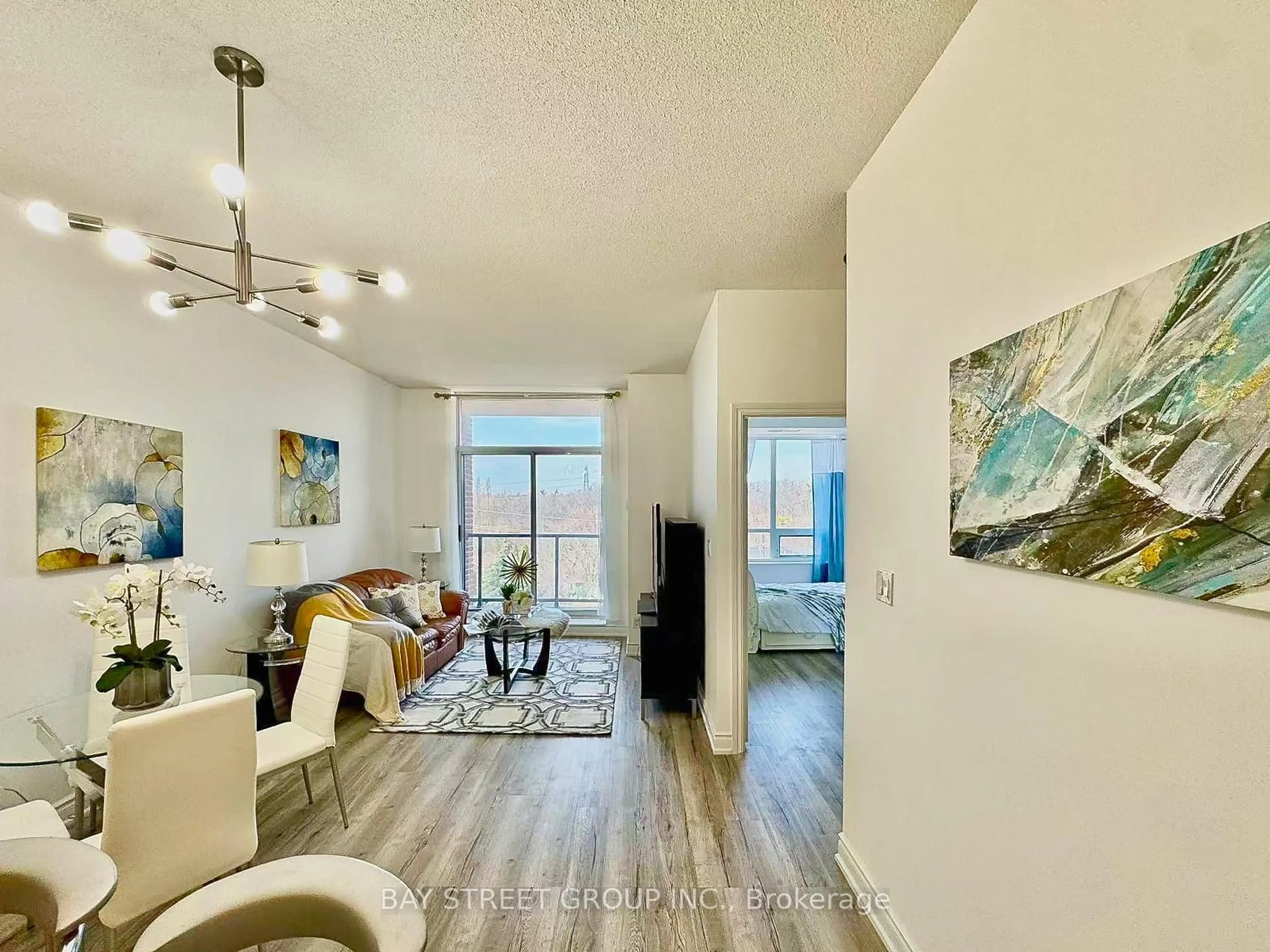 Living room with furniture, wood/laminate floor for 25 Earlington Ave #507, Toronto Ontario M8X 3A3