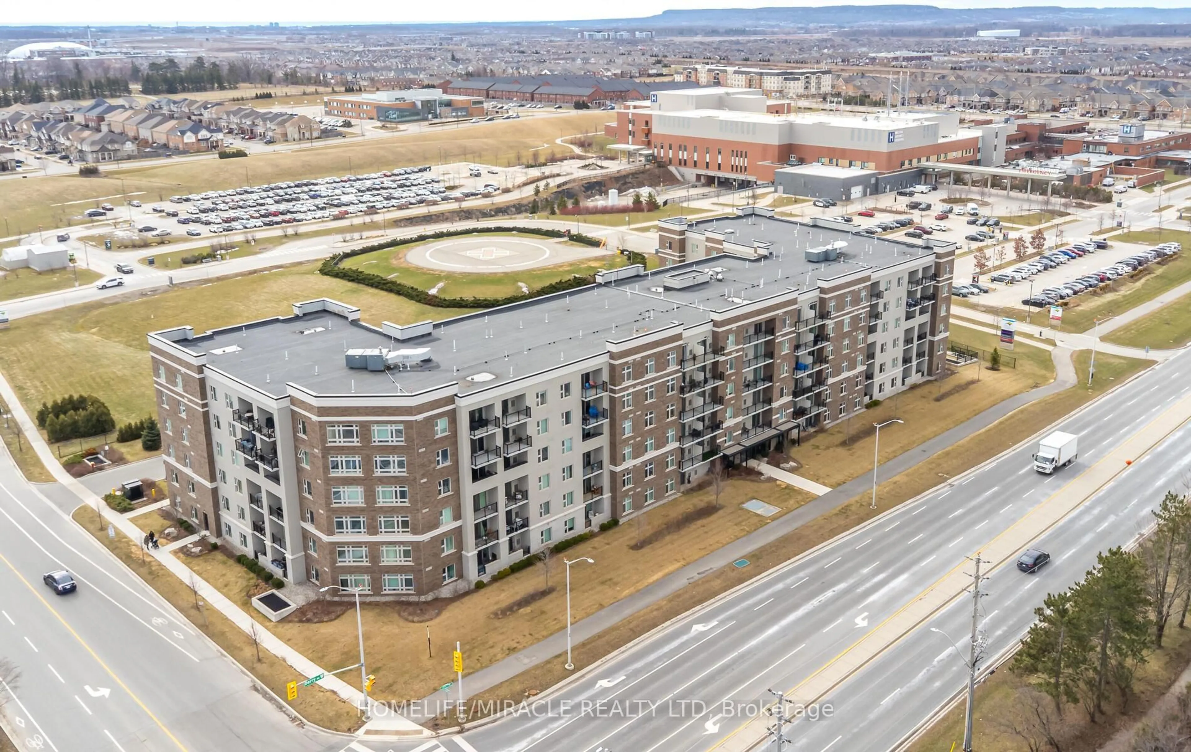 A pic from outside/outdoor area/front of a property/back of a property/a pic from drone, city buildings view from balcony for 610 Farmstead Dr #116, Milton Ontario L9T 7H6