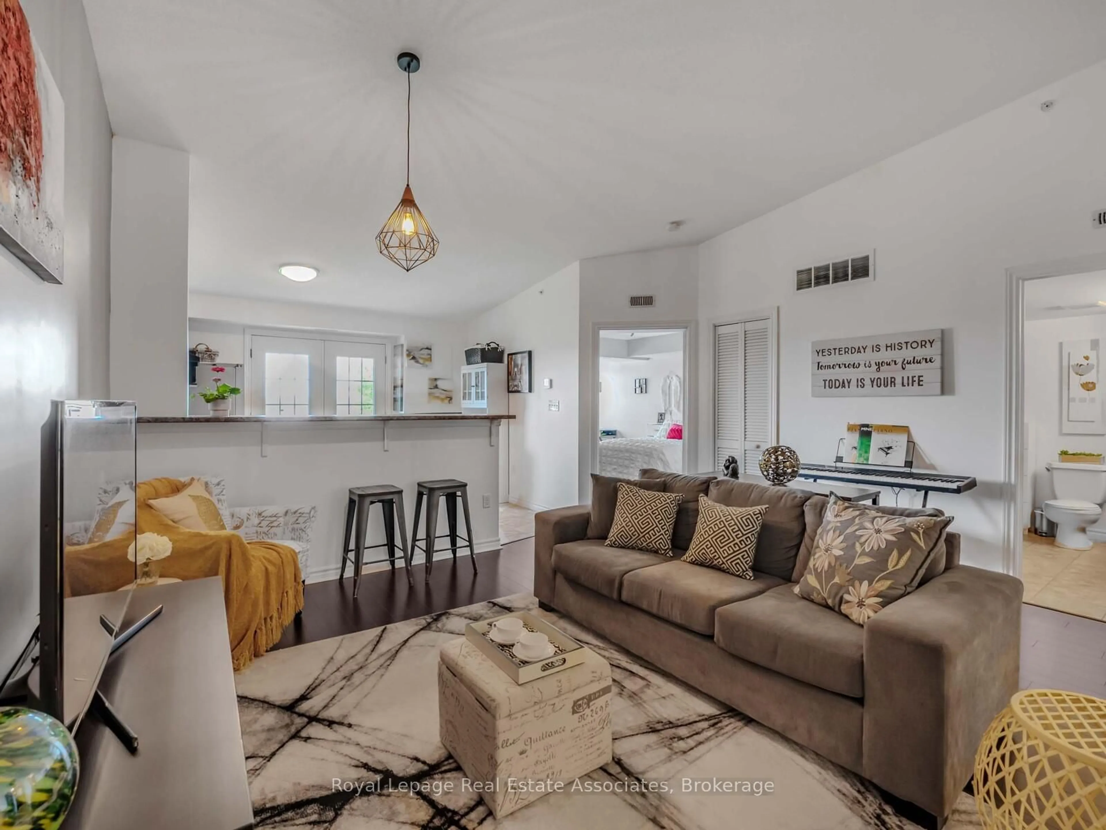 Living room with furniture, unknown for 1390 Main St #405, Milton Ontario L9T 7S9