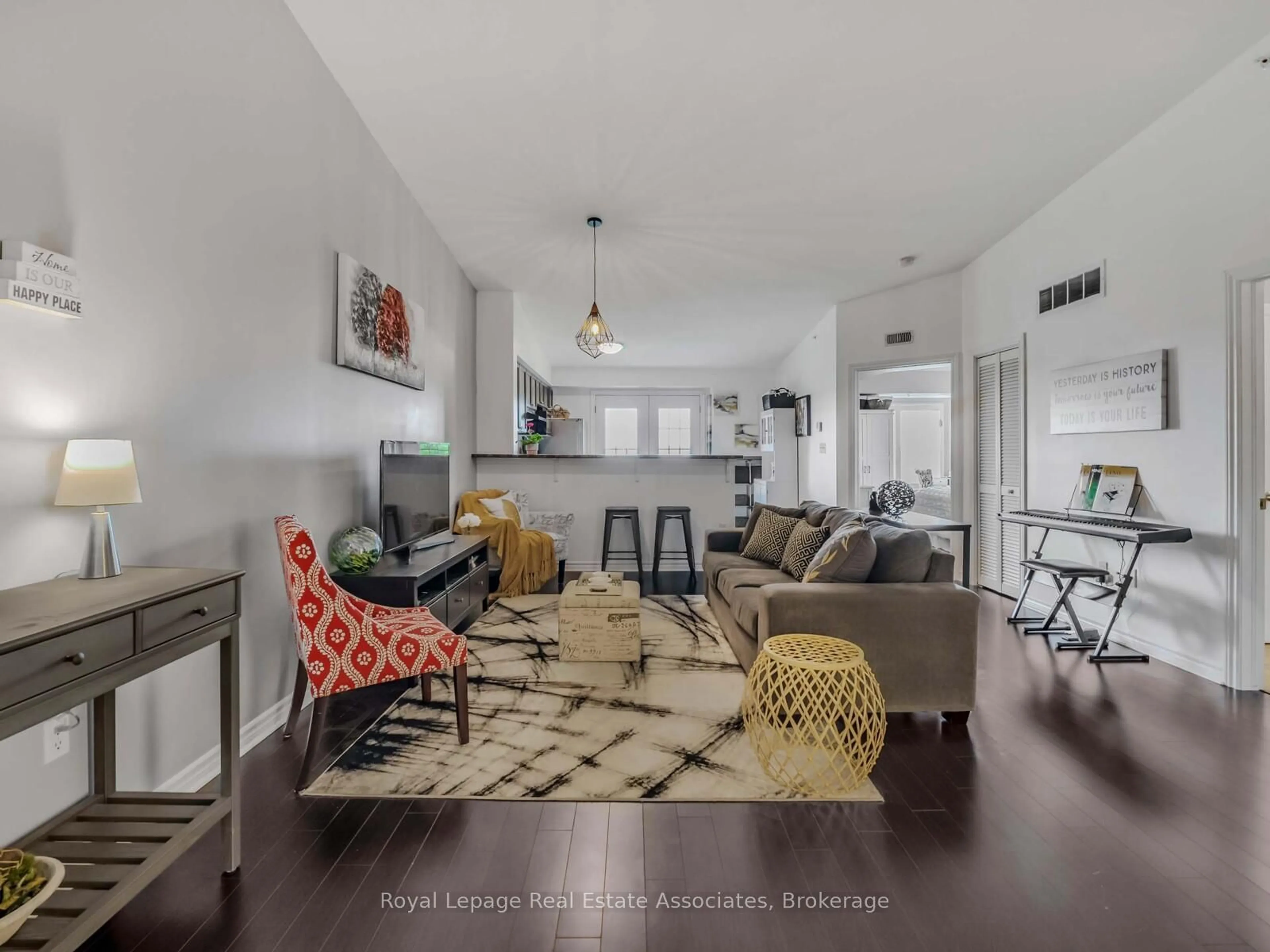 Living room with furniture, unknown for 1390 Main St #405, Milton Ontario L9T 7S9