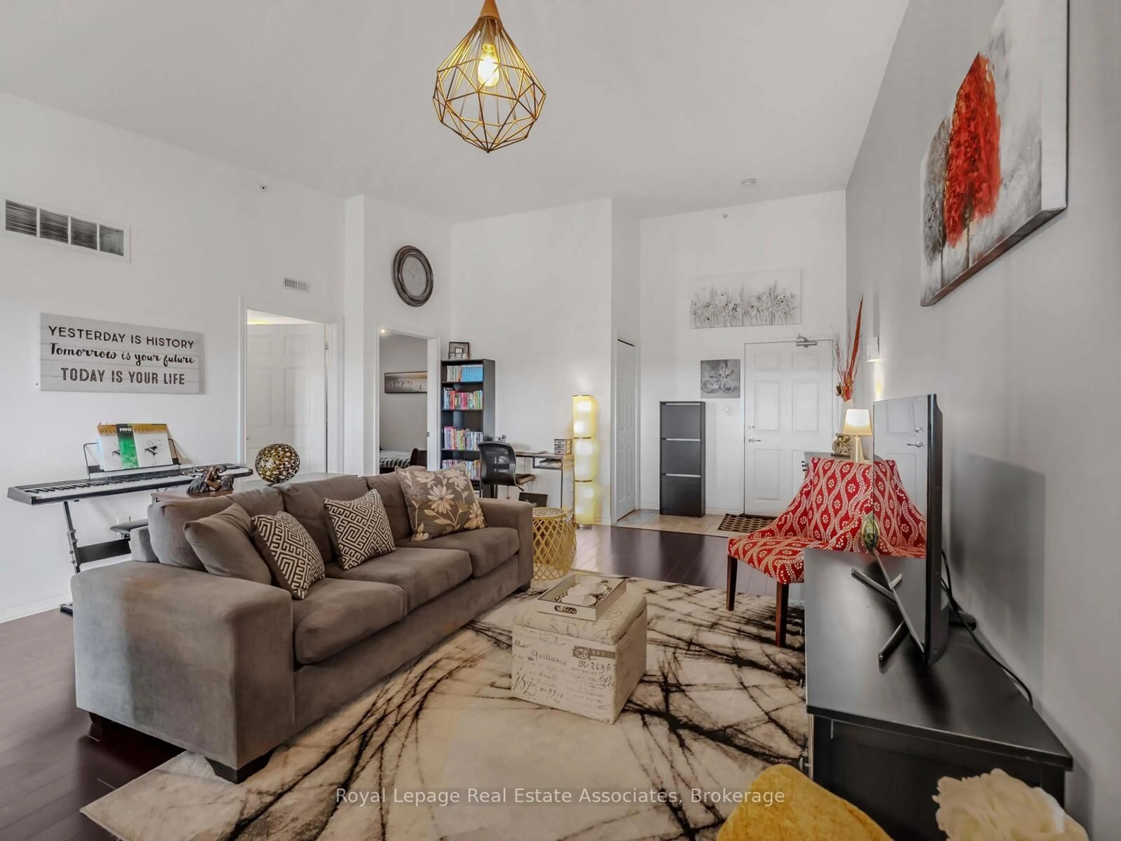 Living room with furniture, unknown for 1390 Main St #405, Milton Ontario L9T 7S9