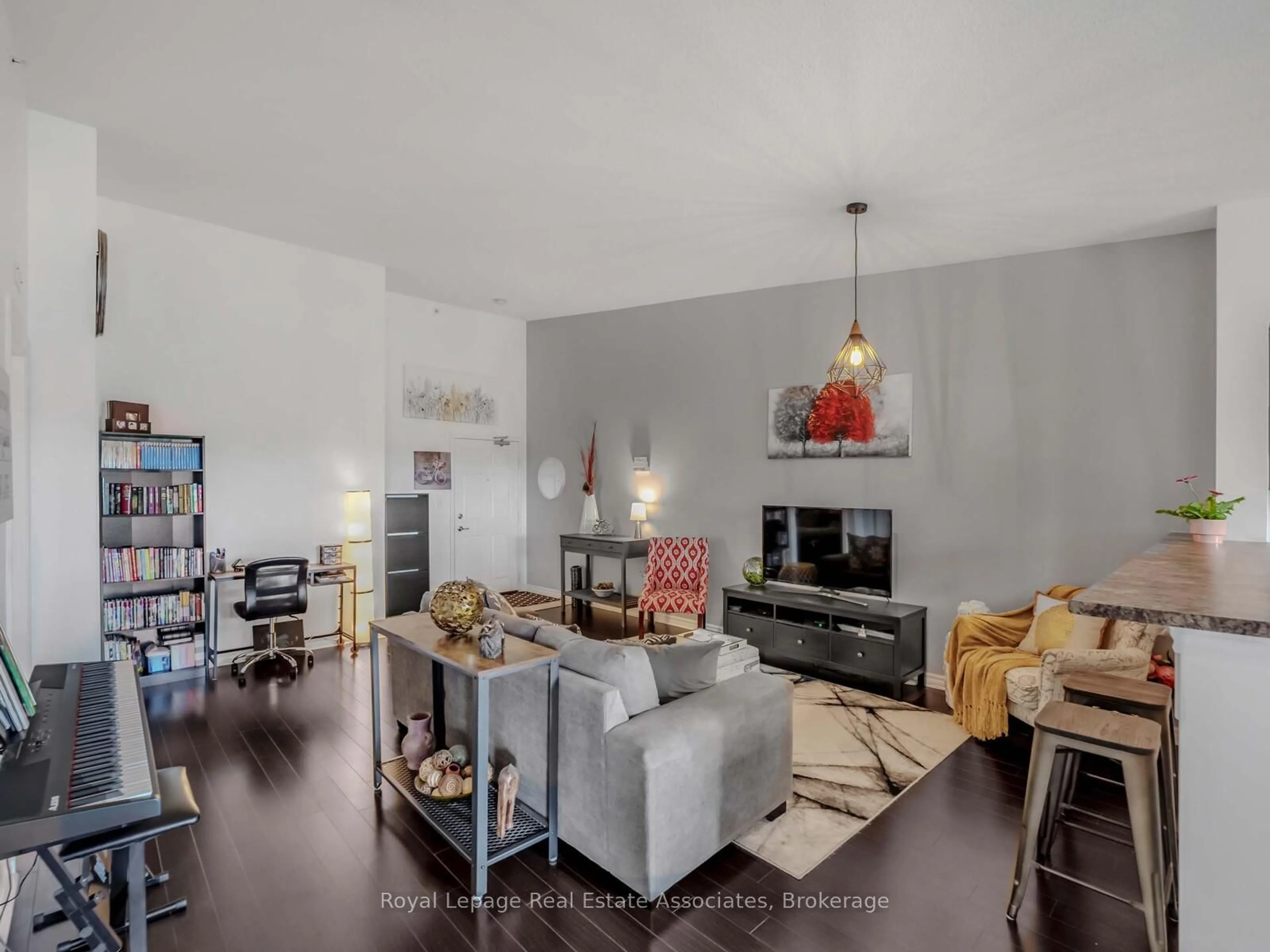 Living room with furniture, unknown for 1390 Main St #405, Milton Ontario L9T 7S9