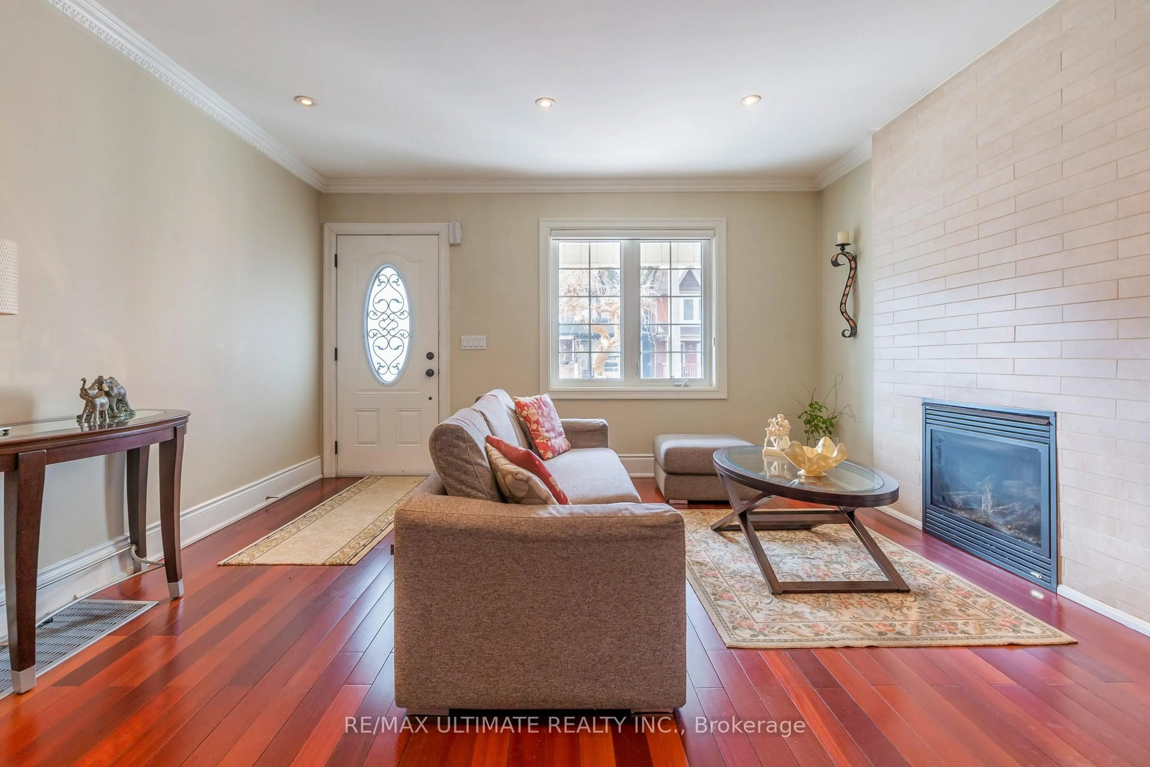 Living room with furniture, wood/laminate floor for 116 Ascot Ave, Toronto Ontario M6E 1G2