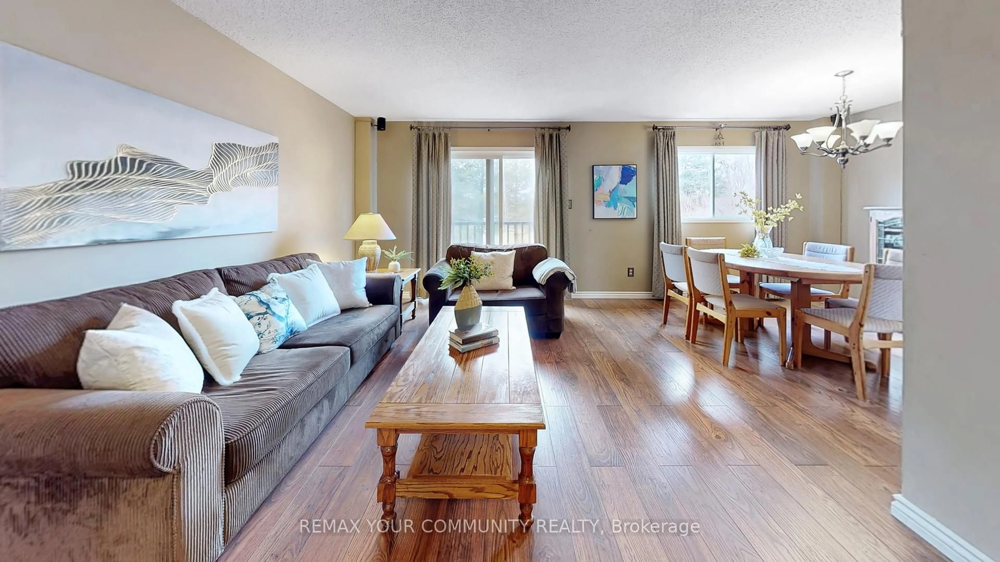 Living room with furniture, wood/laminate floor for 4300 Beacon Lane, Mississauga Ontario L5C 3V9