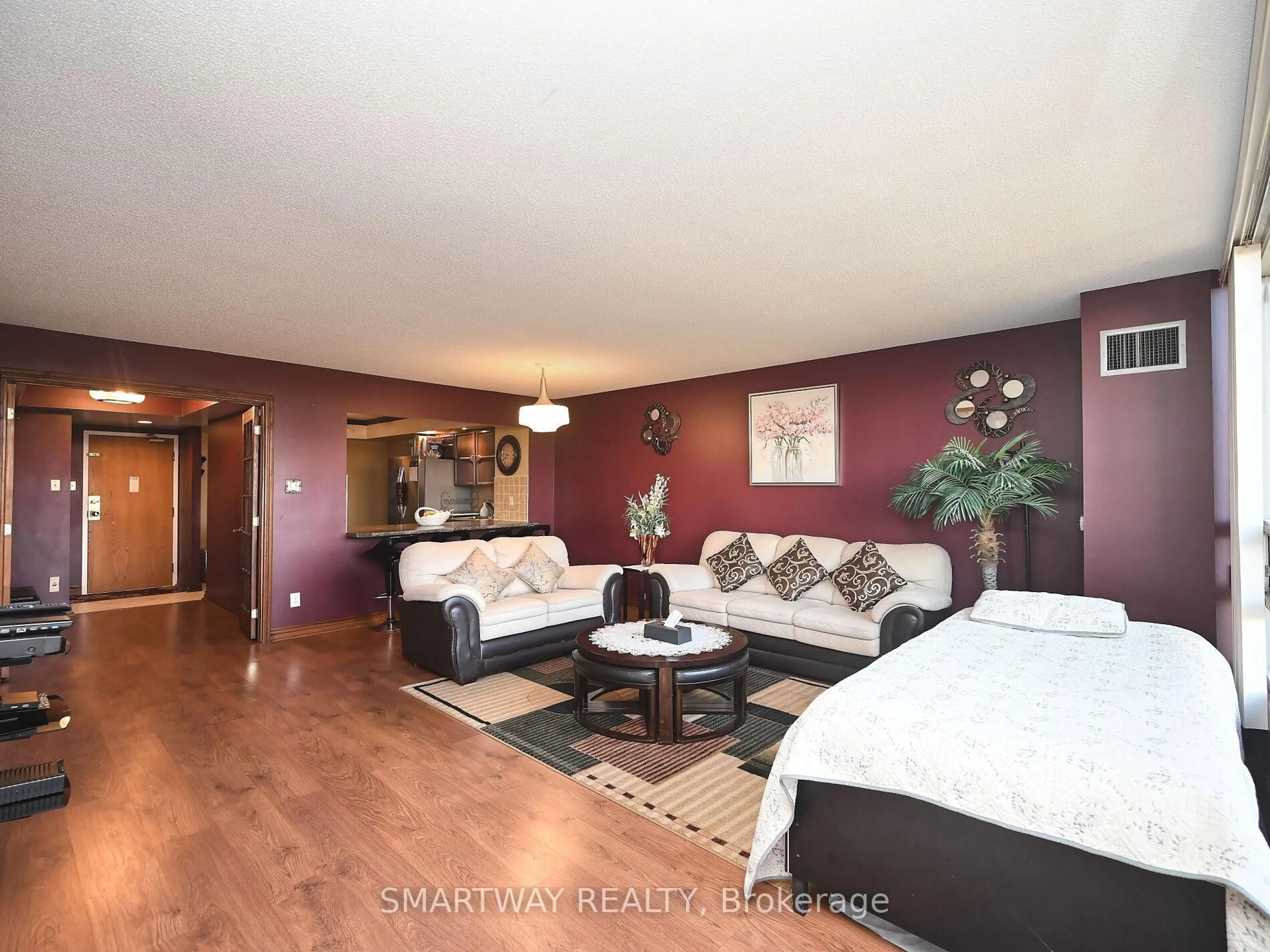 Living room with furniture, wood/laminate floor for 320 Mill St #512, Brampton Ontario L6Y 3V2