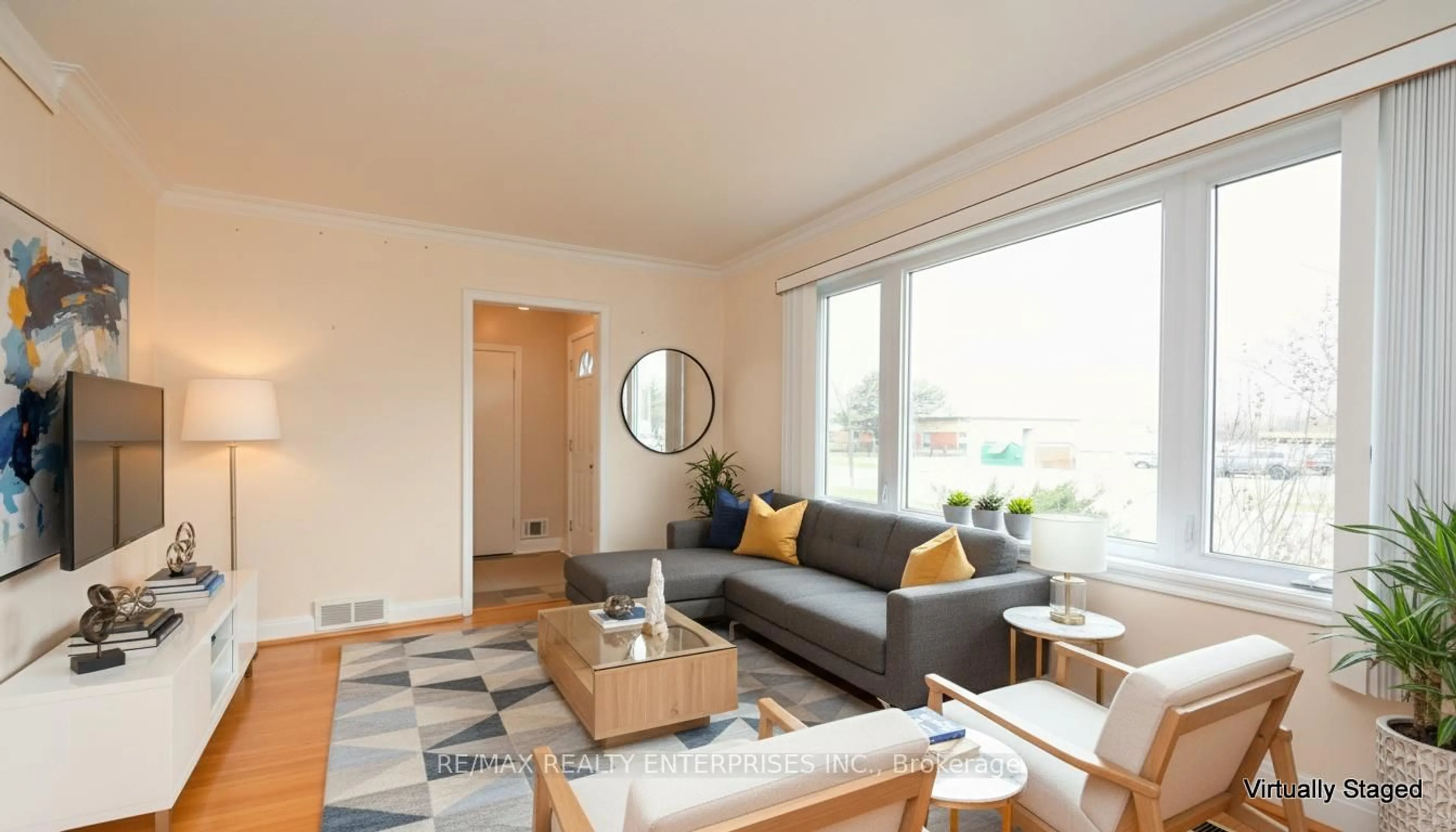 Living room with furniture, wood/laminate floor for 65 Hadrian Dr, Toronto Ontario M9W 1V6