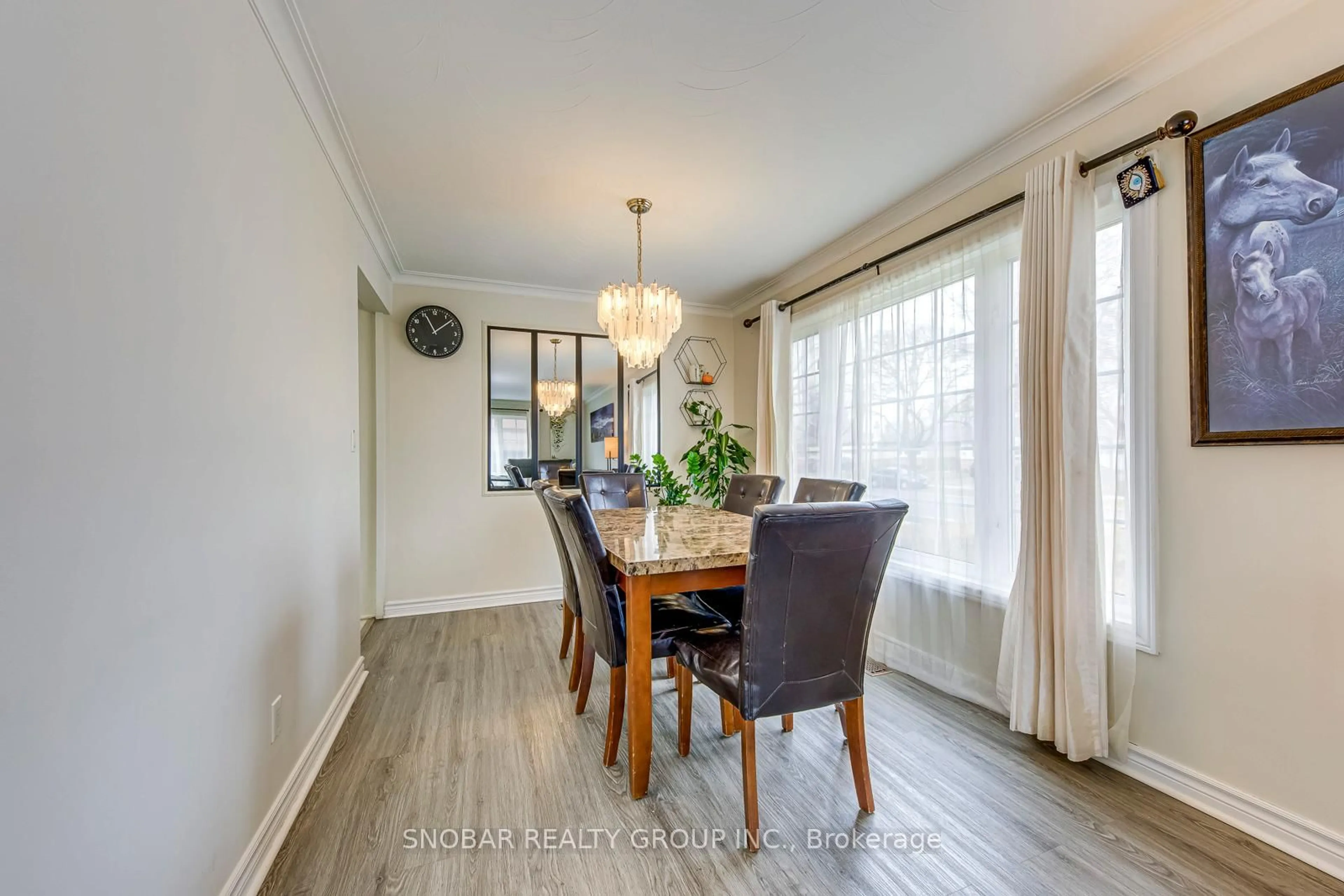 Dining room, wood/laminate floor for 97 Westhampton Dr, Toronto Ontario M9R 1Y1