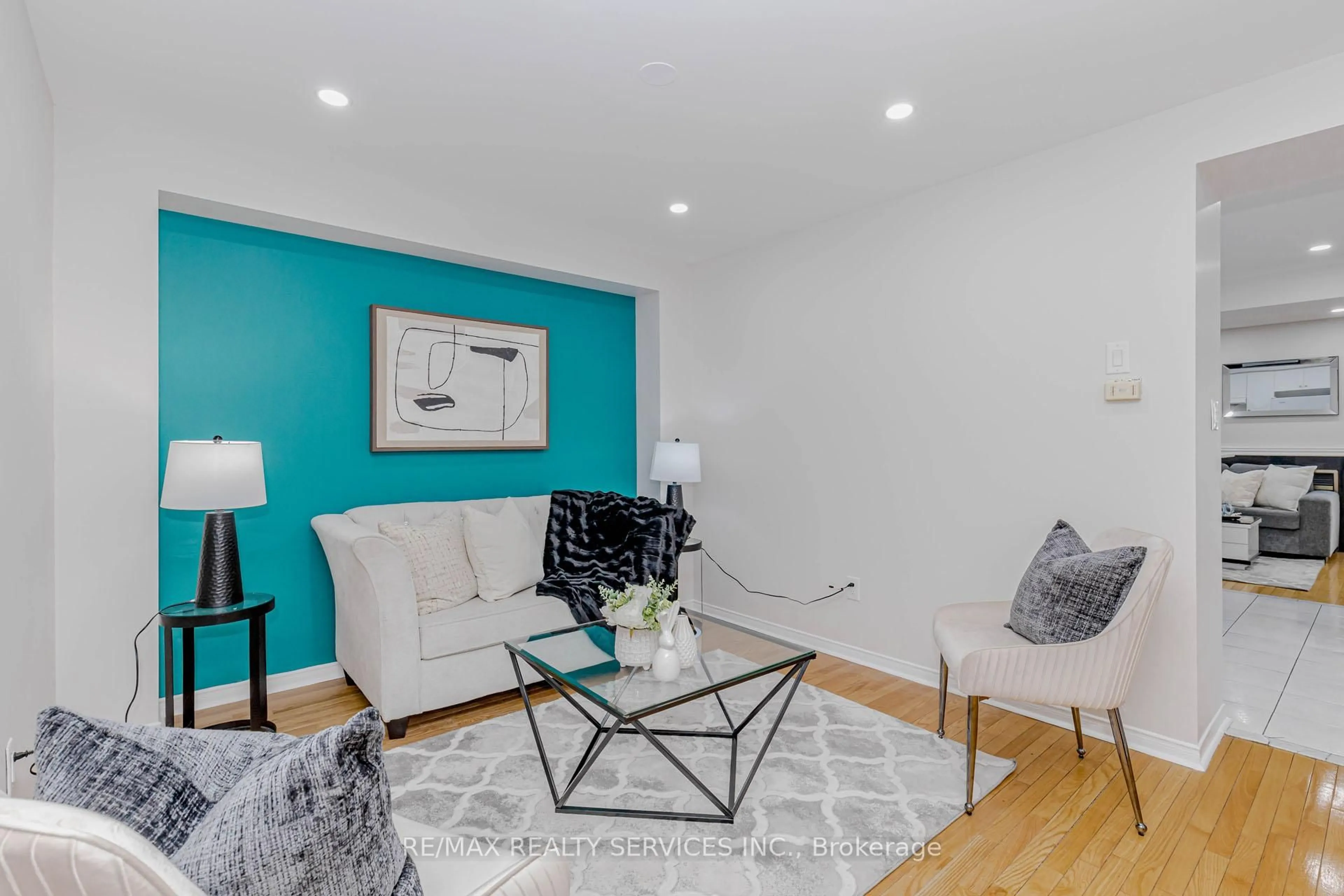 Living room with furniture, wood/laminate floor for 102 Sand Cherry Cres, Brampton Ontario L6R 3B2