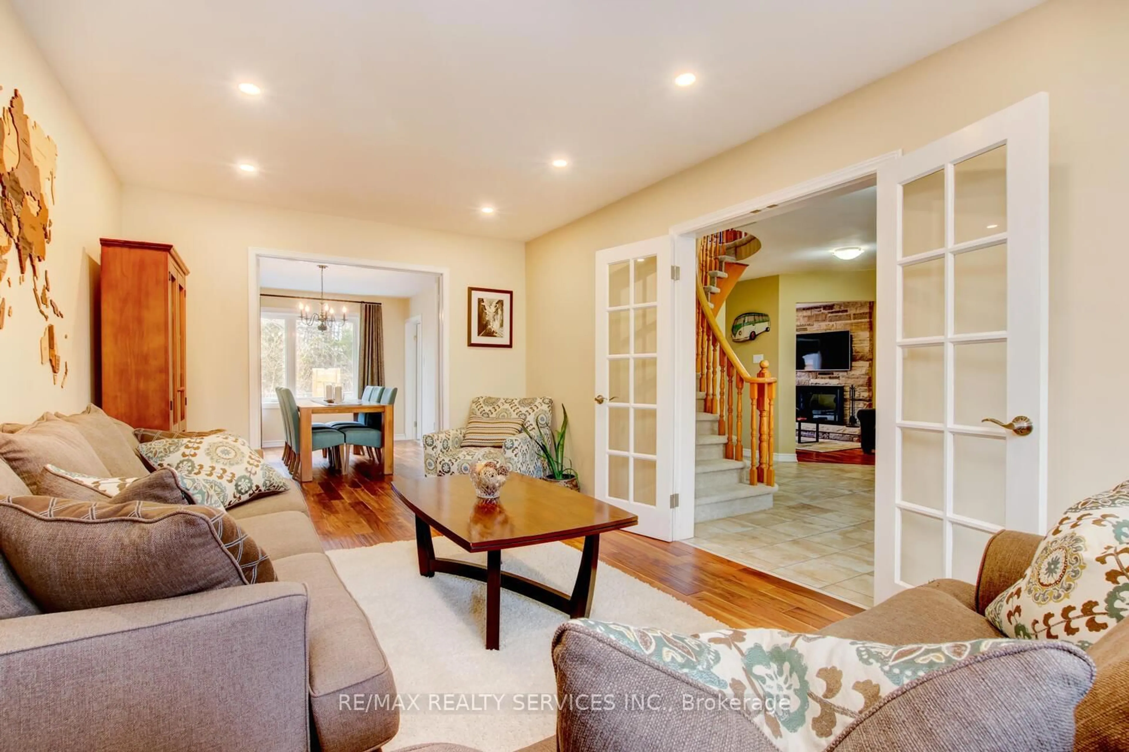 Living room with furniture, wood/laminate floor for 28 Chickadee Cres, Brampton Ontario L6Z 3L2